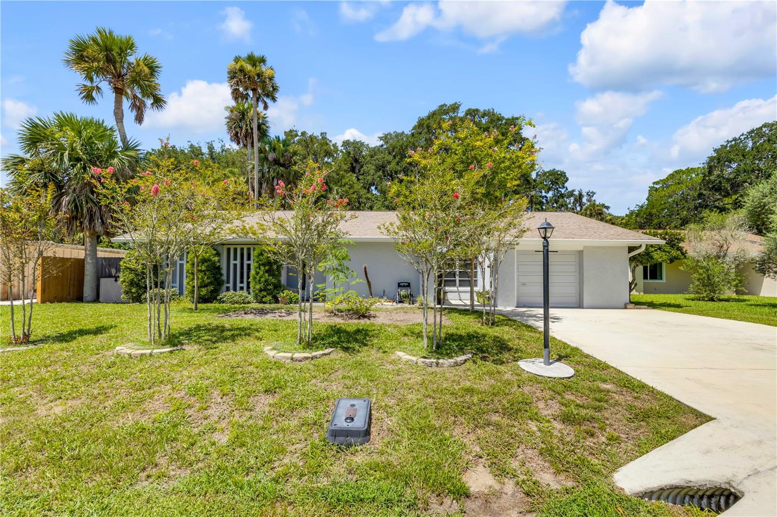 Welcome to this beautifully maintained Palm Coast home, perfectly positioned with breathtaking golf course views right from your backyard! Offering 3 bedrooms, 2 bathrooms, and 1,459 square feet of thoughtfully designed living space, this property blends comfort, style, and Florida living at its finest. Inside, you'll find an open and inviting floor plan where the living room flows seamlessly into the kitchen, featuring stainless steel appliances, a large center island, and abundant cabinet and counter space. Just beyond, the spacious enclosed Florida room is filled with natural light from an array of windows and showcases a built-in dry bar and shelving, creating the perfect space for entertaining or relaxing while enjoying the picturesque surroundings. The generously sized bedrooms provide plenty of space, while the primary suite includes an updated en suite bathroom with a walk-in shower. Both bathrooms have been tastefully updated for a modern touch. Outside, unwind on the screened and covered lanai overlooking the expansive paver patio, mature landscaping, and the golf course beyond. Additional upgrades include a new roof (2022), gutter system and fascia (2023), newer water heater, 20-foot-wide concrete driveway (2022), patio privacy enclosure, and a 50-square-foot storage shed. Conveniently located near shopping, dining, Palm Coast Marina, and Florida's beautiful coastline, this exceptional home offers the best of the Palm Coast lifestyle. Mortgage savings may be available for buyers of this listing.