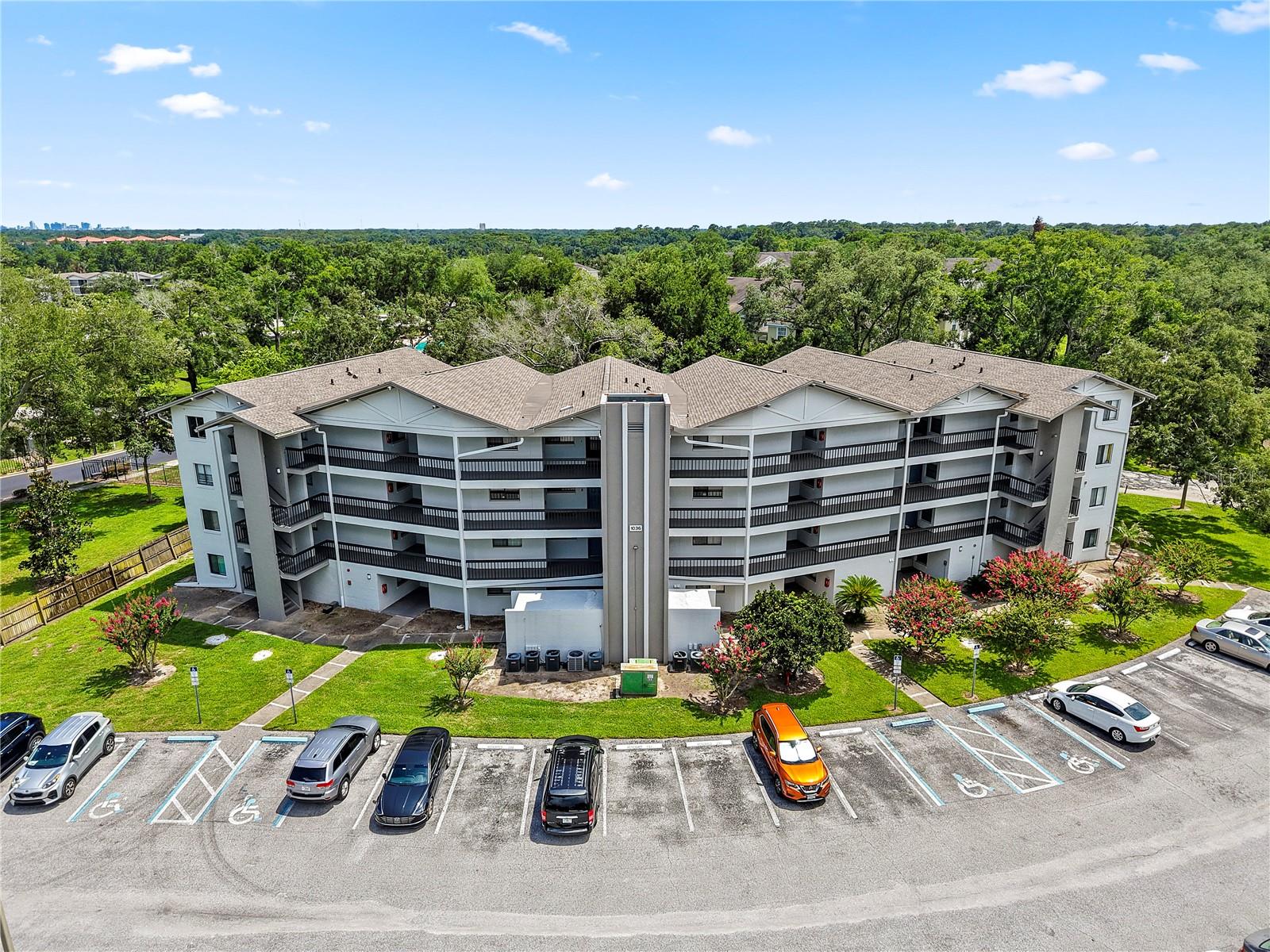 Welcome to the desirable Lake Lotus Club—a serene lakefront community in Altamonte Springs. This well-maintained 2-bedroom, 2-bath condo located on the third offers convenience with elevator access and a spacious open floor plan spanning over 1,000 square feet of living space. Step inside to find tile flooring throughout, a large living and dining area, and an updated kitchen featuring stainless steel appliances, solid surface countertops, and modern cabinetry. The private, screened-in balcony just off the living area provides a peaceful outdoor retreat with views of the landscaped common area. The primary bedroom features a walk-in closet and an en-suite bathroom with a vanity and walk-in shower. A second generously sized bedroom and a full guest bathroom offer flexibility for guests or a home office. The unit also includes a convenient laundry closet. Community amenities include a pool, tennis courts, playground, BBQ area, sidewalks, and access to Lake Lotus for fishing and scenic enjoyment. Zoned for Lake Brantley High School, and ideally located near SR 434, SR 436, Maitland Blvd, and I-4, offering quick access to shopping, dining, and entertainment. This move-in ready condo offers convenience, comfort, and a great lifestyle. Schedule your private showing today!