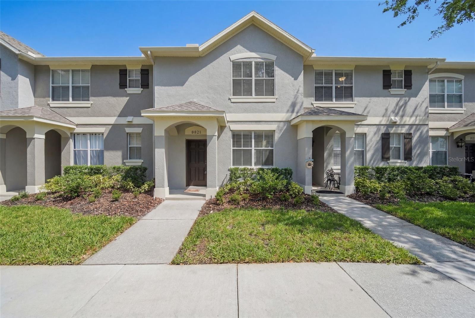 Welcome home to this beautifully maintained 2-bedroom, 2.5-bath townhome nestled within a charming tree-lined community. This home offers a peaceful setting while ideally located just minutes from Disney, this home offers both convenience and comfort in one of Windermere's most desirable areas.

This well cared for home is move-in-ready, clean and bright. The thoughtfully designed layout includes two spacious primary suites, each with its own private bath featuring both a tub and shower; a valuable upgrade that adds flexibility and luxury. The main level offers an inviting living and dining area, a convenient half bath for guests, and a renovated kitchen with all appliances included!

Step outside to enjoy the extended patio and private fenced courtyard, perfect for relaxing, entertaining, or enjoying Florida's beautiful weather. A 2-car rear-entry garage provides ample parking and storage. 

Perfectly positioned just steps from the community pool, this home offers easy access to one of the neighborhood's most enjoyable amenities. You'll enjoy easy access to shopping, dining, major roadways, Disney, and all that the Windermere area has to offer.
