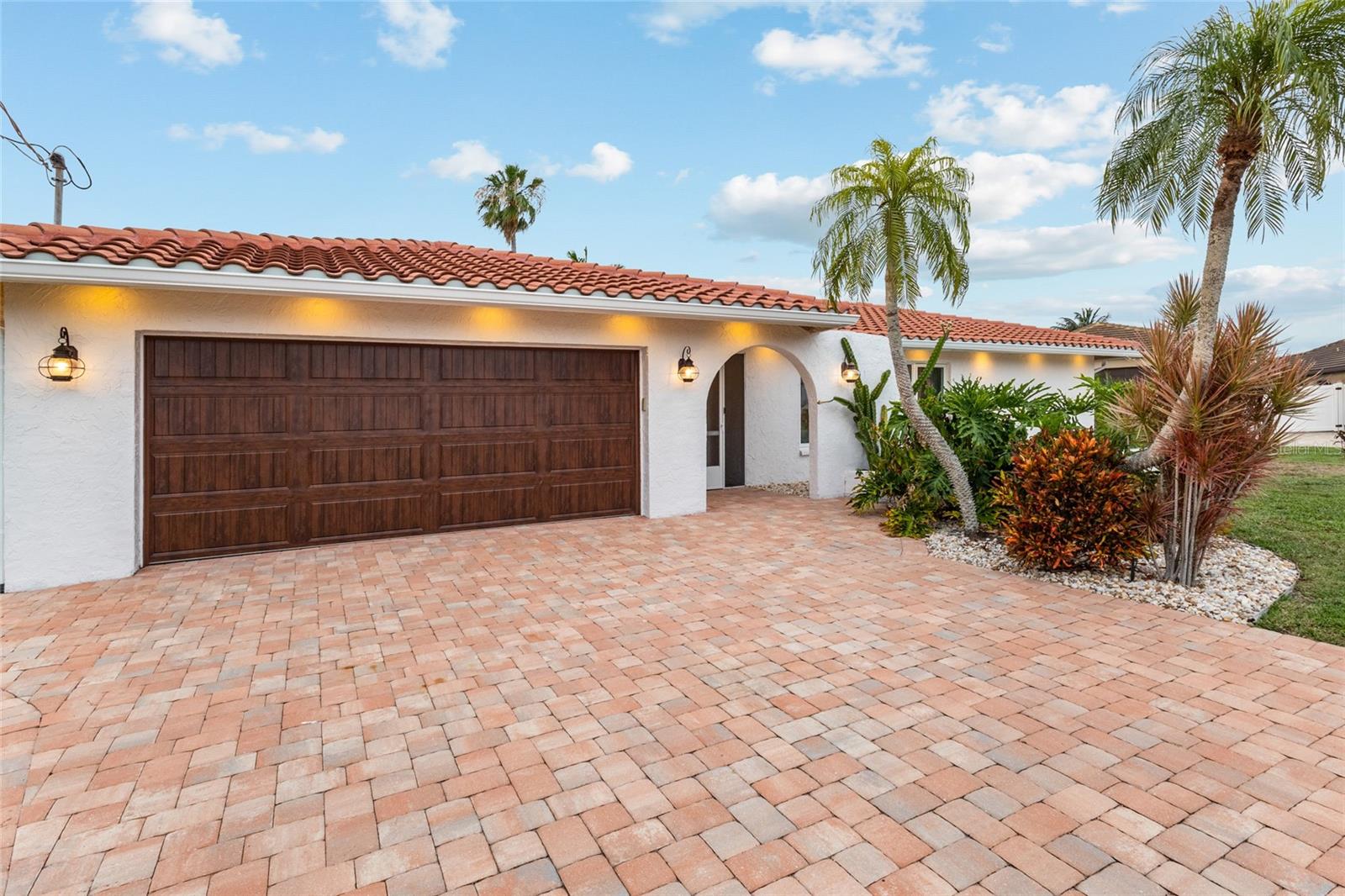 WATERFRONT PARADISE IN THE HEART OF GULF COVE! Welcome to 12508 Bacchus Road, a truly exceptional waterfront retreat situated on an OVERSIZED TIP LOT boasting an incredible 165 FEET OF WATER FRONTAGE and BREATHTAKING OPEN WATER VIEWS. This meticulously maintained residence offers the perfect blend of luxury, comfort, and investment potential with THREE SPACIOUS BEDROOMS, EACH FEATURING A PRIVATE EN-SUITE BATHROOM—making it ideal as a primary residence, seasonal getaway, or LUCRATIVE VACATION RENTAL.

Step outside and experience Florida waterfront living at its finest. The NEW COMPOSITE DOCK (2023) features a SUN DECK perfect for relaxing, fishing, or enjoying spectacular sunsets. The expansive lot provides ample room to accommodate an ADDITIONAL DOCK AND BOAT LIFT, creating endless possibilities for boating enthusiasts. Cool off in the SPARKLING INGROUND GUNITE SWIMMING POOL while taking in the stunning water views from nearly every angle.

Inside, no detail has been overlooked. The beautifully updated kitchen is equipped with PREMIUM KITCHENAID APPLIANCES and complemented by elegant CAMBRIA QUARTZ COUNTERTOPS throughout every wet area of the home. Luxurious DARK GREEN ONYX TILE accents each bathroom, creating an elevated coastal feel. Recent upgrades include COASTAL IMPACT WINDOWS AND DOORS, TANKLESS HOT WATER HEATER, PAVER DRIVEWAY, and CEDAR SOFFITS WITH RECESSED LIGHTING.

From the thoughtfully designed interior finishes to the pristine outdoor spaces, every square foot of this property showcases exceptional pride of ownership and attention to detail. Best of all, this home is being offered FULLY FURNISHED—simply bring your suitcase and start enjoying the Southwest Florida lifestyle from day one.

Properties with this combination of OPEN WATER VIEWS, 165 FEET OF WATER FRONTAGE, A PRIVATE POOL, THREE EN-SUITES, UPDATED LUXURY FINISHES, AND TURNKEY FURNISHINGS rarely become available in Gulf Cove. Schedule your private showing today and discover why this is one of the area's most impressive waterfront opportunities.