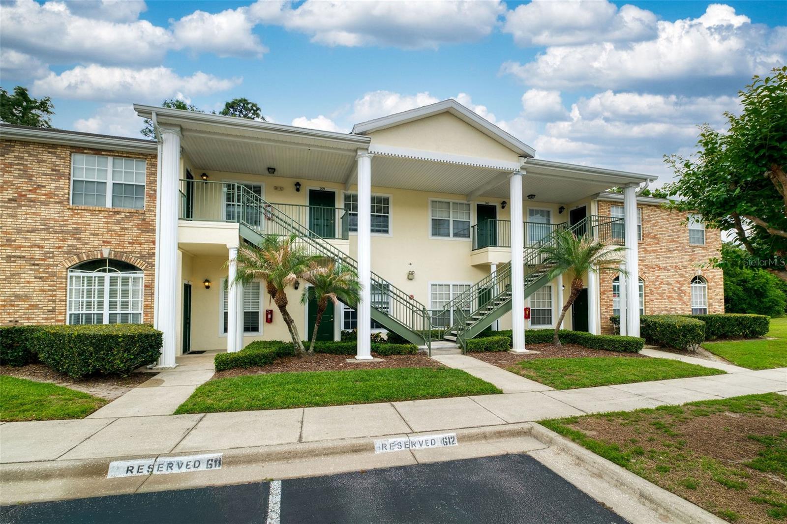 One or more photo(s) has been virtually staged. Welcome to this beautifully updated 2-bedroom, 2-bathroom first-floor end-unit condominium offering nearly 1,000 square feet of stylish and comfortable living in a prime Orlando/Oviedo location near UCF. This light-filled home features an open-concept living, dining, and kitchen layout with high ceilings, crown molding, tile flooring throughout, new lighting and fresh interior paint, creating a clean and modern feel from the moment you step inside. The renovated kitchen is a standout feature, showcasing white cabinetry, updated stainless steel appliances (2025), a pantry closet, and a cozy breakfast nook—perfect for both everyday living and entertaining. The kitchen flows seamlessly into the main living space, making it ideal for gathering with family and friends. A convenient laundry closet with stackable washer and dryer adds to the home’s functionality. Both bathrooms have been thoughtfully renovated with stylish, contemporary finishes. The primary suite offers a spacious retreat with a walk-in closet, ceiling fan, and a beautifully updated en-suite bathroom featuring a quartz-top vanity and tub/shower combination. The secondary bedroom is well-sized and versatile, with easy access to the renovated hall bathroom featuring a fully tiled, modern shower. French doors lead to a screened-in rear lanai, providing a peaceful outdoor space to relax and unwind, along with an additional exterior storage/utility closet. This unit also includes a reserved parking space conveniently located directly in front of the home. Located in a quiet, well-maintained community known for its friendly neighbors and low monthly HOA fees, residents enjoy easy access to everything Central Florida has to offer. Walk or bike to UCF’s main campus, and enjoy being just minutes from shopping, dining, and major roadways including SR-408. Whether you’re a first-time homebuyer, investor, or looking for low-maintenance living in a safe and convenient location, this move-in-ready home is an exceptional opportunity. HVAC - 2022 WATER HEATER - 2022