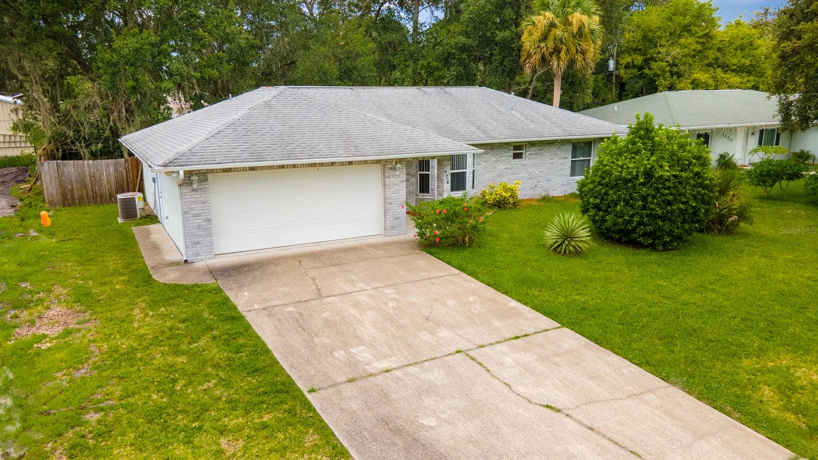 SELLER SAYS BRING OFFERS!!  Solid construction home built in 2005 with storm grade garage door, metal corrugated shutters for windows, brick facing, and block exterior.  Welcome home to this contemporary styled 3/2 ranch home on the northern side of Florida Shores.  Vaulted ceilings and an open floor plan greet you upon entry with the kitchen bar bordering the living room it is the perfect place to congregate, entertain, relax, and live.  The split bedrooms allow the separation of space and sanity desired by today's buyers.  From the dining room, out of the french doors is an inviting patio and huge back yard giving you a flexibility of space and uses.  Lots to offer - come and see for your self! ;Water: City