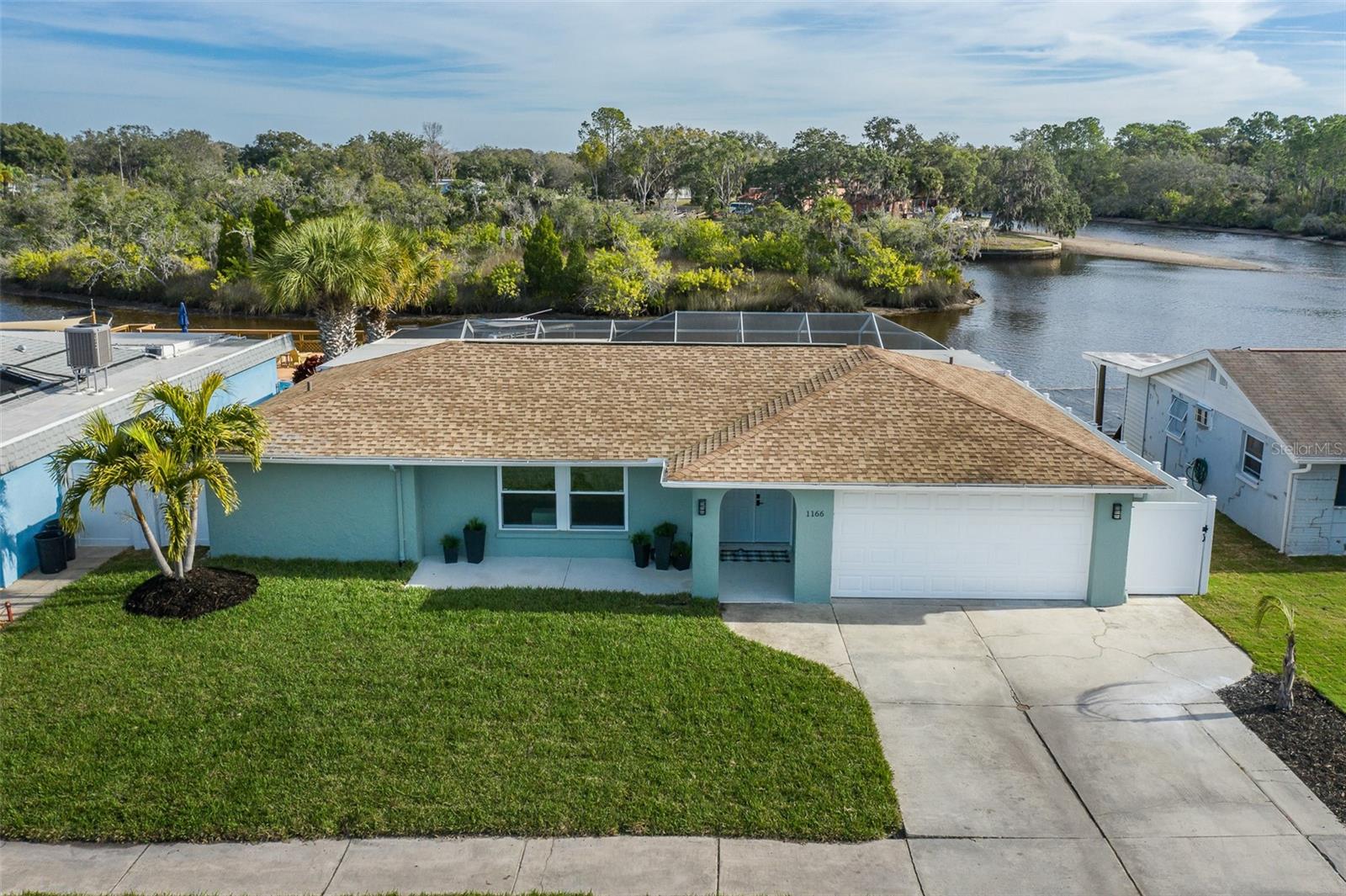 Stunning fully remodeled 4-bedroom, 3-bath waterfront home offering privacy, functionality, and true Gulf-access living. This exceptional property has remained high and dry with no flooding during recent storms, providing peace of mind along with an unbeatable natural setting. Set along a scenic bend of the river, the backyard overlooks a private island preserve—meaning no rear neighbors, just nature. Dolphins, manatees, and a wide variety of birds are frequent visitors, creating a tranquil waterfront backdrop rarely found. The thoughtfully designed split floorplan features two complete en suites located on opposite sides of the home, ideal for multigenerational living, guests, or added privacy. The home has been meticulously maintained and extensively upgraded.

Outdoor & Waterfront Features include:
10,000 lb boat lift with dock
Heated chlorine pool with new variable-speed pool pump (2024)
New pool heat pump (2024)
Gravity overflow pool drain to prevent overfilling
New stainless steel boat lift cables (2025)

Interior & Systems Upgrades:
Brand-new kitchen with ventless hood, microwave, dishwasher (2026), refrigerator, and stove (2025)
Moen motion-sensor kitchen faucet with WiFi/app control (2025)
Propane tankless hot water heater on demand (2025)
Additional electric on-demand water heater available (can be reconnected)
Whole-home 5-stage Halo water treatment system (2025)
Entire home repiped with Uponor PEX water lines (2025)

Efficiency, Safety & Storm Readiness:
Generator-ready electrical setup
EV charging outlet in garage
Commercial-grade garage door opener and fully rebuilt garage door (springs, rollers, hinges – 2025)
Electrical panel installed 2018
Roof (2018)
Air handler and heat pump (2018)
Additional blown-in attic insulation (2025)
New doors and windows (2025)

Additional Features:
New 4-zone front yard sprinkler system with WiFi-controlled pump (private well water – 2025)
ADT security system with fire and carbon monoxide detection
Nest Ring doorbell and garage camera convey

This home offers true waterfront privacy, modern systems, and extensive upgrades, making it ideal for full-time living or a refined coastal retreat with direct Gulf access.