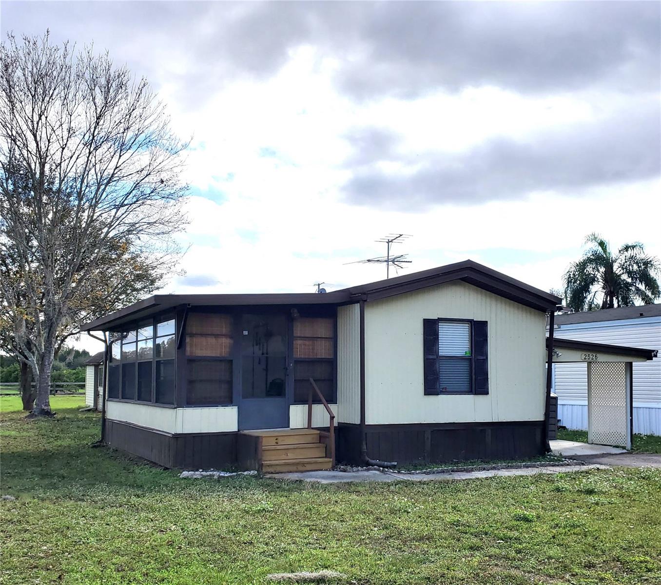 Well maintained mature 50 + adult 2 bedroom, 2 bath mobile home located in a small, quiet, 10 unit mobile home community with long term tenants. Can be Partially furnished with kitchen table/chairs, leather sofa and loveseat and washer/dryer. This mobile home has a 1 car carport, a large enclosed/screen porch, plus a small side porch with a small area for shelf storage. Small bedroom can be used as a computer room or hobby room. Paradise Cove Mobile Home Park is located close to hospitals, doctors, pharmacy and restaurants.  No smoking. Must show proof of income. A background and credit check is required with a copy of current driver license, or passport if doesn't drive. Paradise Cove Mobile Home Park will provide a copy of the Rules & Regulations.  Lawn service, water and sewer is included in the rent.  Must have an appointment. Do not go to property directly. General requirements are a 650 or better credit score and a verifiable income and good rental history. All measurements should be verifiable. Can be rented unfurnished. A small storage shed is available if needed.
