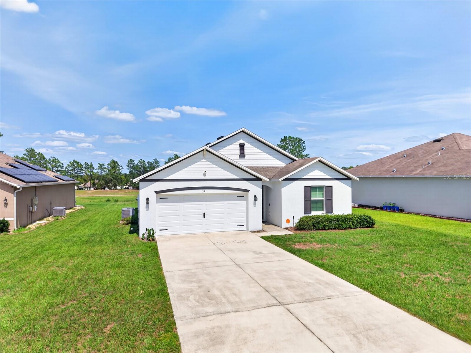 Welcome to this beautifully maintained 4-bedroom, 2-bathroom home located in the sought-after Lake Diamond community of Ocala! Built in 2019 and offering 1,788 square feet of thoughtfully designed living space, this move-in-ready home sits on one of the largest lots in the neighborhood at an impressive 0.34 acres and backs directly to the Lake Diamond Golf Course, offering peaceful views and an open feel rarely found in neighborhood living. Inside, you’ll find a spacious open-concept layout designed for both everyday comfort and entertaining. The kitchen serves as the heart of the home, featuring abundant cabinetry, generous counter space, and a large center island overlooking the living and dining areas, creating the perfect flow for gatherings. Beautiful tile and luxury vinyl flooring run throughout the home, providing style, durability, and easy maintenance with no carpet to worry about. The split-bedroom floor plan offers privacy and functionality, while the spacious primary suite provides a relaxing retreat after a long day. Built in 2019, this home offers the peace of mind of newer construction with no major updates needed, plus the added convenience of city water and sewer. Step outside and enjoy the rare luxury of an oversized backyard with direct golf course frontage—perfect for relaxing, entertaining, or simply enjoying the peaceful setting and extra space between neighbors. Conveniently located just minutes from shopping, dining, medical facilities, schools, and everyday conveniences, this home offers the perfect combination of comfort, location, and value. With a low HOA of only $25 per month, this is an incredible opportunity to own a newer home on one of the premier lots in Lake Diamond. Schedule your private showing today!