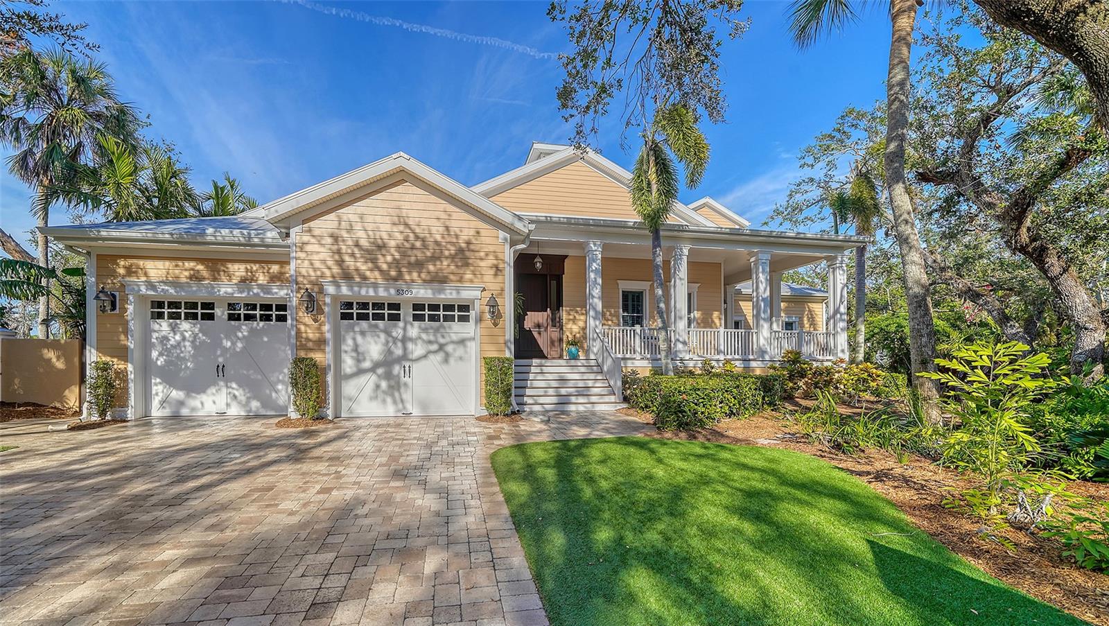 Majestic waterfront home nestled in one of Siesta Key's most exclusive neighborhoods. Prime waterfront location with direct access to the inter-coastal (no bridges) and features a 16,000 pound vertical lift and a jet ski lift. This Waterfront home features wraparound decks on multiple levels composed of Brazilian Ipe decking, wood ceilings, a private grill area with a dramatic view up the canal and a resort like swimming pool and spa featuring a rock waterfall and paver patio to fill your sun filled afternoons. Upon entering the home, you will see the amount of detail and craftsmanship that was put into this home. Hand-scraped wood flooring, coffered tongue-n-groove ceilings, huge baseboard and crown molding throughout. Expansive windows let the natural light in and an aquarium glass wall in the kitchen/family room overlooks your lower deck, swimming pool, spa and water view. The home has well over 6000 square feet of living area with the master suite occupying the first-floor level. This home affords 6 bedrooms, 5 full baths, 2 half baths, a private office with built-in cabinetry, 2 wet bars one on each level, 2 laundries with one on each level, a Sports room/ man cave with a built-in entertainment center. Upstairs has 4 bedrooms, two of which are suites, a second family room/playroom, theater/entertainment room which connects to your second level deck. The main level of the home incorporates your kitchen, family room, pantry, wet bar, dining room, private office, master suite and laundry. The kitchen features a huge walk-in pantry with entry door, a huge center island with a granite top, Subzero refrigerator, a Wolf 6 burner/griddle stove, a Wolf warming drawer, a Wolf microwave, 2 drawer Fisher Paykel dishwasher and a second Miele dishwasher for all your entertainment needs. Each level has a wet bar with the lower level having a subzero wine refrigerator and a drink refrigerator and the upstairs level has a Fisher Paykel dishwasher, an ice-maker, microwave, and a refrigerator. For the car enthusiast you have two 2 car garages with separate drives which provides additional parking as well. This spectacular home is hard to match, and you won't be disappointed. The home has an elevation of 15 feet and also has a home generator to provide comfort and a sense of security during any power outages that may occur. Schedule an appointment to see your future home!