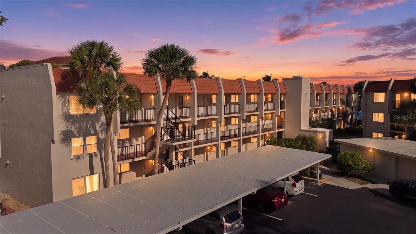 Wonderful Venice Island location, this Beautiful Turnkey Furnished Condominium invites you to relax and unwind in a garden style setting! Premier Corner Residence features a delightful outdoor paver patio, additional windows that fill the interior with natural light and the ease of first floor living. Interior finishes include tile floors, crown molding, chair rail and plantation shutters. Open concept great room design with built-in shelves and lanai opens to the outdoor paver patio. Imagine relaxing with an iced tea on your lanai, enjoying the serene garden view! You will love the bonus room providing versatile space for a dining area, a cozy den or guest quarters. The updated Kitchen includes tray ceiling, wood cabinets, sparkling granite countertops, dine-in area and a convenient stacked washer and dryer. The primary suite features a cozy built-in alcove with lighting and shelves, an ensuite bath with tiled walk-in frameless shower and spacious walk-in closet. Desirable split bedroom plan ensures privacy for family or guests and the second bedroom includes an ensuite bath with shower and roomy walk-in closet. Situated along the Intracoastal Waterway, Bella Costa is conveniently located just two blocks from the vibrant heart of downtown Venice offering a multitude of dining venues, boutique shopping, Farmer's Market and events, or enjoy the Venice Symphony and performances at the Venice Theater. Just a quick one-mile trip to gorgeous Venice Beach and the Gulf's inviting turquoise water, let's not forget the breathtaking Gulf Coast sunsets, yours to enjoy every evening with your feet in the sand. Bella Costa offers a resident clubhouse complete with full kitchen and great room, ideal for hosting larger gatherings, sparkling heated pool, library, exercise room and billiards making it a wonderful retreat for you, your family and guests. The property includes covered assigned carports, as well as a storage closet for your beach gear, golf clubs, and bicycles. Offered Turnkey Furnished, this condo provides the ultimate convenience for immediate occupancy, vacation stays, or rental opportunities, an incredible Venice Island opportunity just waiting for you!