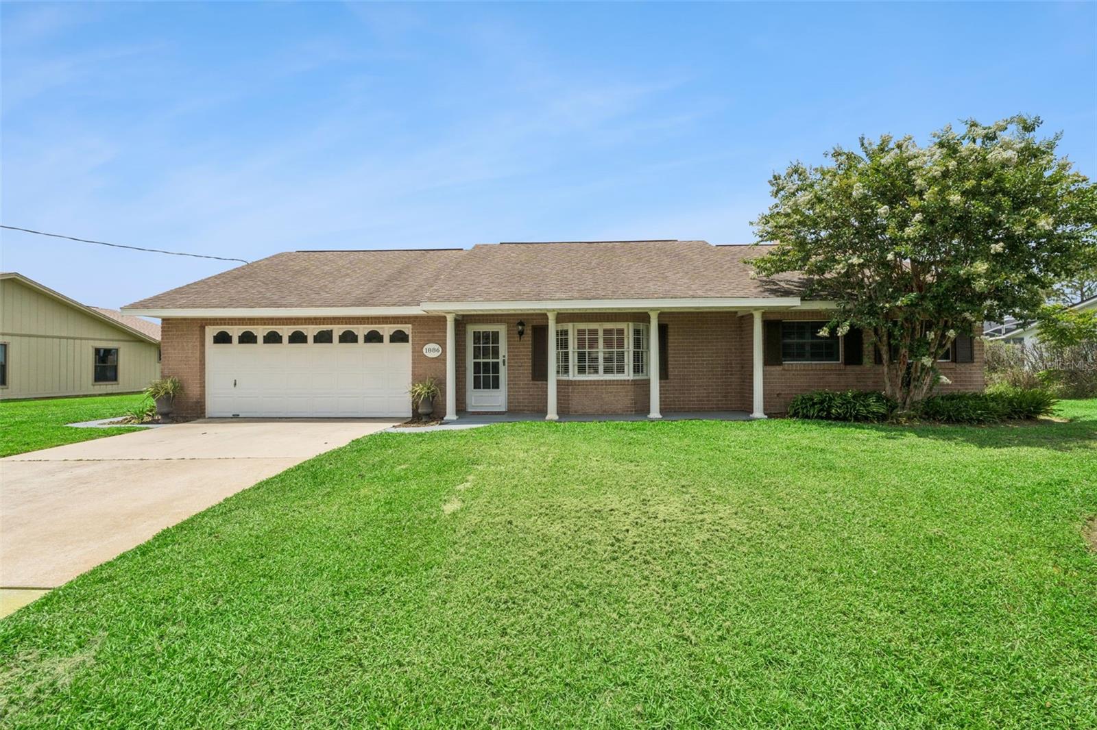 Welcome to this beautiful waterfront retreat located on a spacious 0.34-acre cleared lot in the heart of Deltona. Offering a functional split-bedroom layout, this solid masonry and stucco residence features both a cozy family room and a spacious living room designed for effortless gathering. The bright, open living room serves as the heart of the home, framing peaceful, picturesque views of the lake right outside your window. Step out back to enjoy a sizable, well-landscaped yard that leads directly down to the water, complete with your own private floating dock—perfect for fishing, launching kayaks, or enjoying stunning Central Florida sunsets. Complete with an attached two-car garage for convenient parking and extra storage, this property provides plenty of freedom and flexibility. Situated in a well-established neighborhood just minutes from local schools, shopping, dining, and Veterans Memorial Park, this lakefront gem offers the ultimate Florida lifestyle. Schedule your private viewing today.