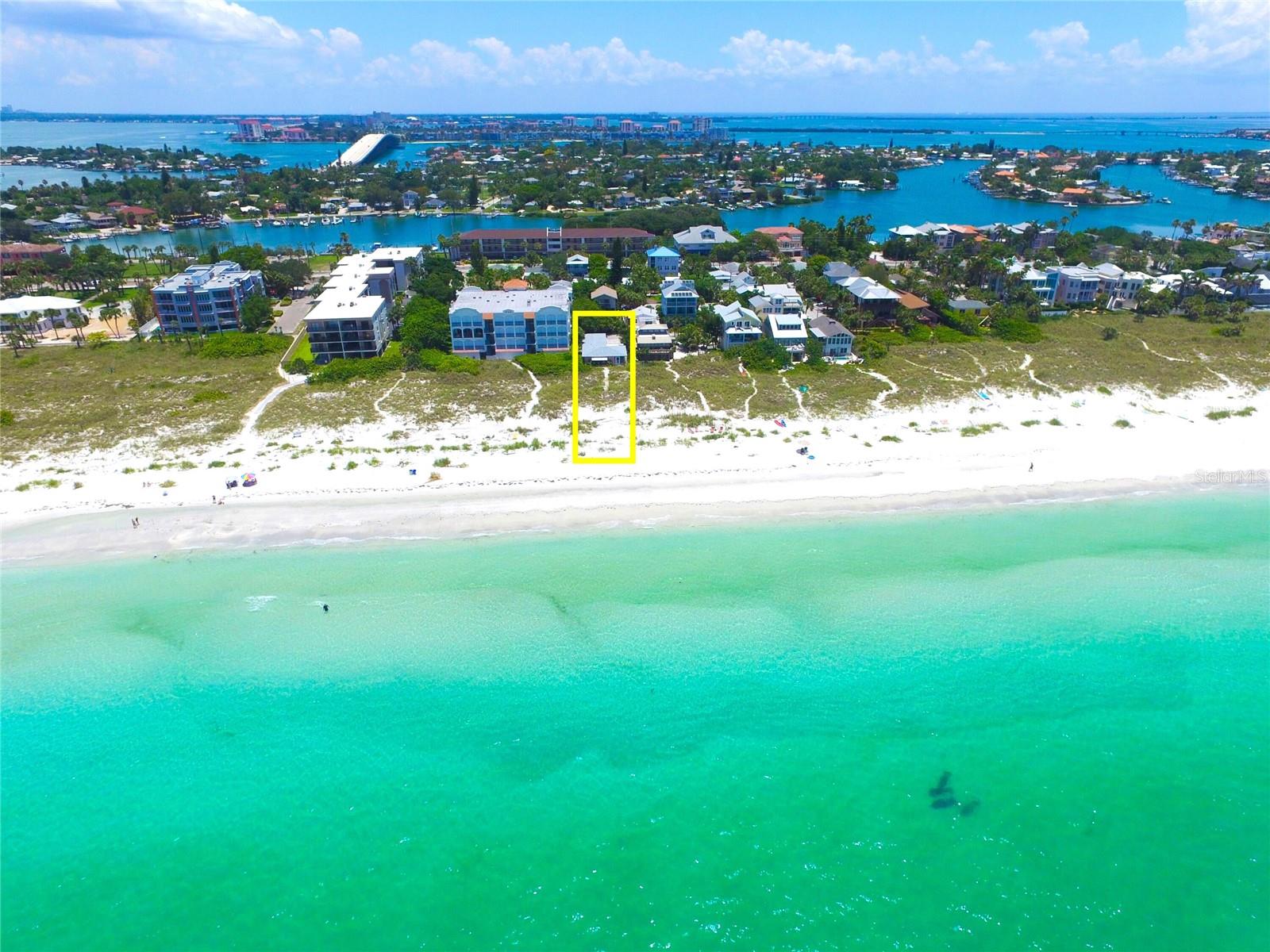 Rare opportunity to own a beachfront home in Tampa Bay’s historic and high-demand Pass-A-Grille. Approx. 250 yards south of the world-renowned Don Cesar Beach Resort on the sugar-white sands and warm turquoise waters of the “#1 Beach In America”… in the highly desirable Pass-A-Grille, St Pete Beach with unobstructed views north to Clearwater and south past Egmont Key and of course west over the Gulf of Mexico with the most beautiful sunsets. This property is one of only a few beachfront homes where the property line extends out through the dunes to the "Mean High Tide Water Line" and is the closest home west to the dunes on Pass-A-Grille Beach giving you amazing views up & down the coast. The home is currently a 2 bedroom 2 bath with a 1 car garage. Many possibilities for renovating the existing home or designing new construction. The current structure is solid and can be easily renovated. With convenient access to I-275 and close proximity to the vibrant downtowns of St. Petersburg and Tampa, enjoy a short drive to incredible dining, entertainment and world-class amenities. Or, simply walk out your door and plant your feet in the soft white sand and enjoy the warm waters of the Gulf of Mexico. You'll also enjoy relaxing strolls down quiet alleyways and experience the historic charm of Pass-A-Grille, a quaint seaside village with numerous shops, boutiques and restaurants. Don’t let this exceptional opportunity pass you by.