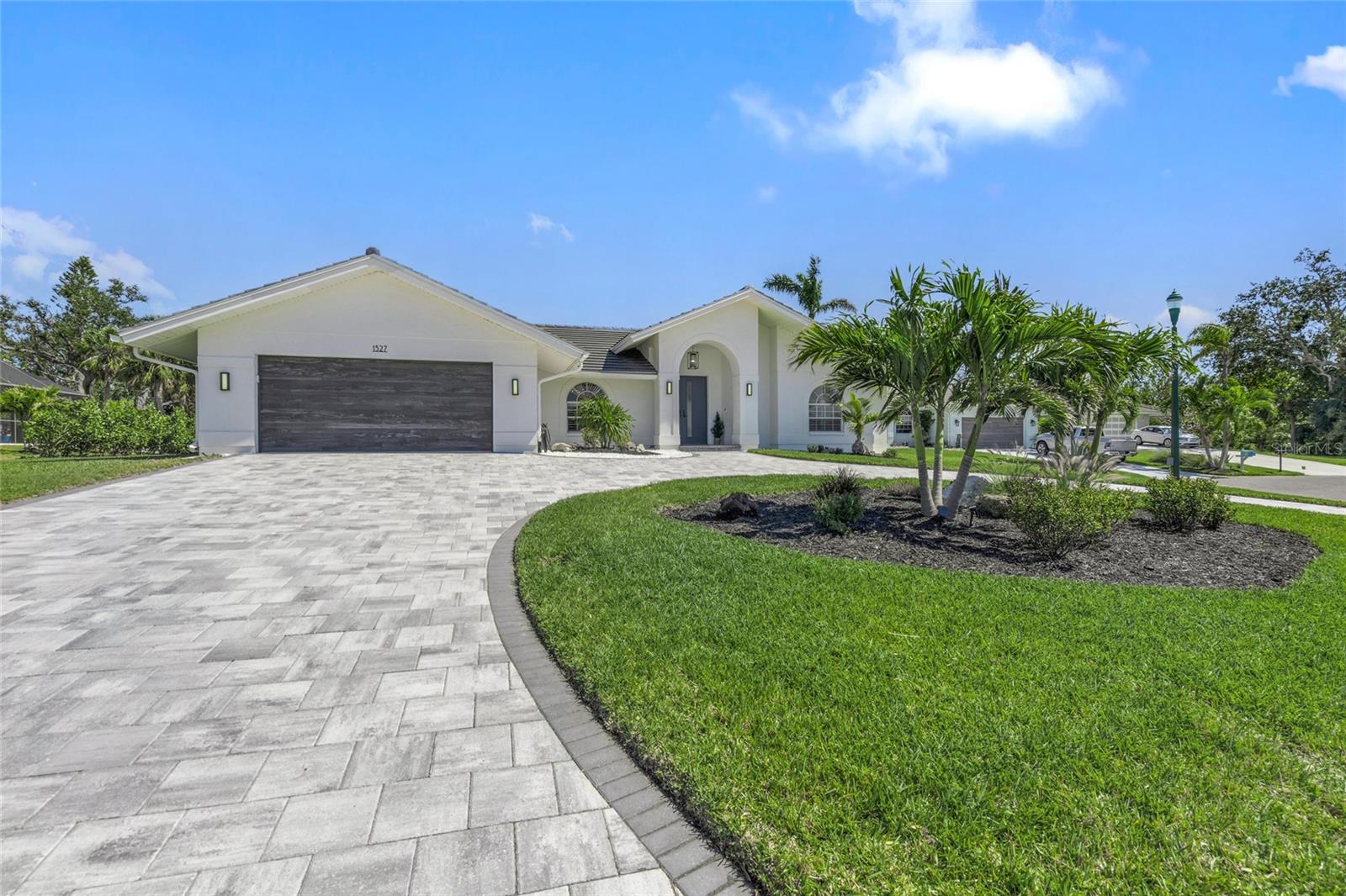 Beautifully and thoroughly recently updated beach style home in Southbay Yacht and Racquet club featuring 10 foot ceilings. 2026 AC unit, 2024 tile roof, 2023 driveway, cabinets, lighting, appliances, tile and carpet are just the beginning. 2023 pool and spa led lighting, Pentair controller, saltwater conversion, and owned 250 gallon propane. Dry bar with ice maker, wine fridge, and beverage fridge. Large covered outdoor living space overlooking the large lanai with tv, private tanning area, and room to entertain. A split bedroom design, game room with space for billiards table, and separate dining area, and great room surround the private courtyard layout designed to entertain. Ample storage throughout including an air conditioned, secure 12x7 storeroom. Southbay Yacht and Racquet Club offers a clubhouse, tennis, pickleball, basketball, shuffleboard, playground, and low fee, exclusive dockage for residents in the deep water marina. Frequent community activities provide opportunities for an active social atmosphere from cruises to sports.