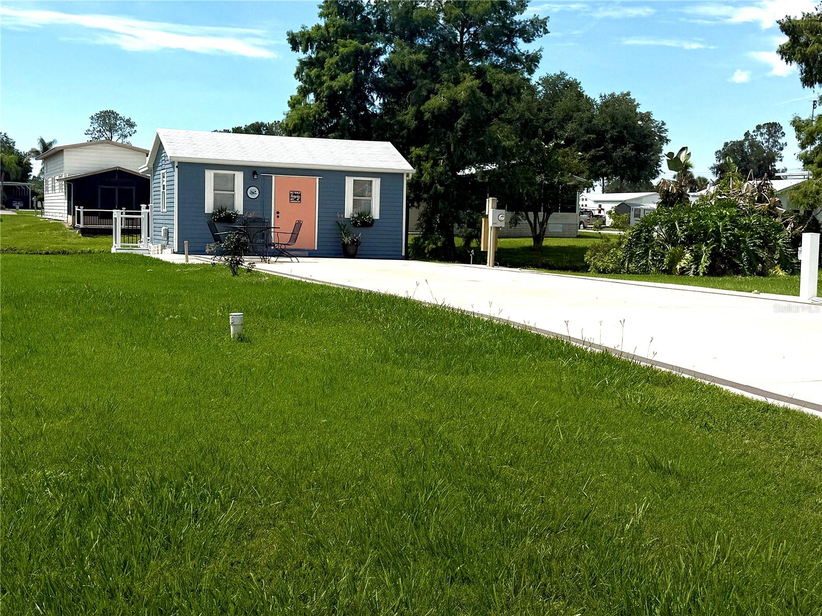 Escape the ordinary and enjoy the waterfront lifestyle from day one at this beautifully improved lot in Mount Olive Shores.

Unlike many vacant lots, this property is already set up for comfortable enjoyment with a fully furnished and air-conditioned 10’ x 20’ casita shed featuring a living area, full bath, and washer and dryer. Step outside to the attached covered porch overlooking the canal—an ideal spot to enjoy your morning coffee, unwind after a day of travel, or simply watch the wildlife pass by.

The oversized concrete pad includes full public utility hookups and 50-amp service, providing ample space for virtually any Class A motorhome. Whether you’re looking for a seasonal retreat, a future homesite, or both, this property offers exceptional flexibility. The 8,703-square-foot parcel is large enough to accommodate a manufactured home and RV port with HOA approval, allowing you to create the Florida motorcoach lifestyle you’ve been envisioning.

Mount Olive Shores residents enjoy a brand-new 5,000-square-foot Community Center featuring a full kitchen, regulation-size shuffleboard and pool tables, card room, library, arcade games, vending area, and covered BBQ lanai. A busy social calendar includes bingo, karaoke, potluck dinners, holiday celebrations, and numerous community events throughout the year.

Conveniently located just minutes from I-4 between Tampa and Orlando, you’ll enjoy easy access to shopping, dining, major medical facilities, airports, and Central Florida attractions.

Opportunities to own a waterfront lot with this level of existing improvement and future potential are becoming increasingly difficult to find. Secure your place in one of Central Florida’s premier Class A motorhome communities today.