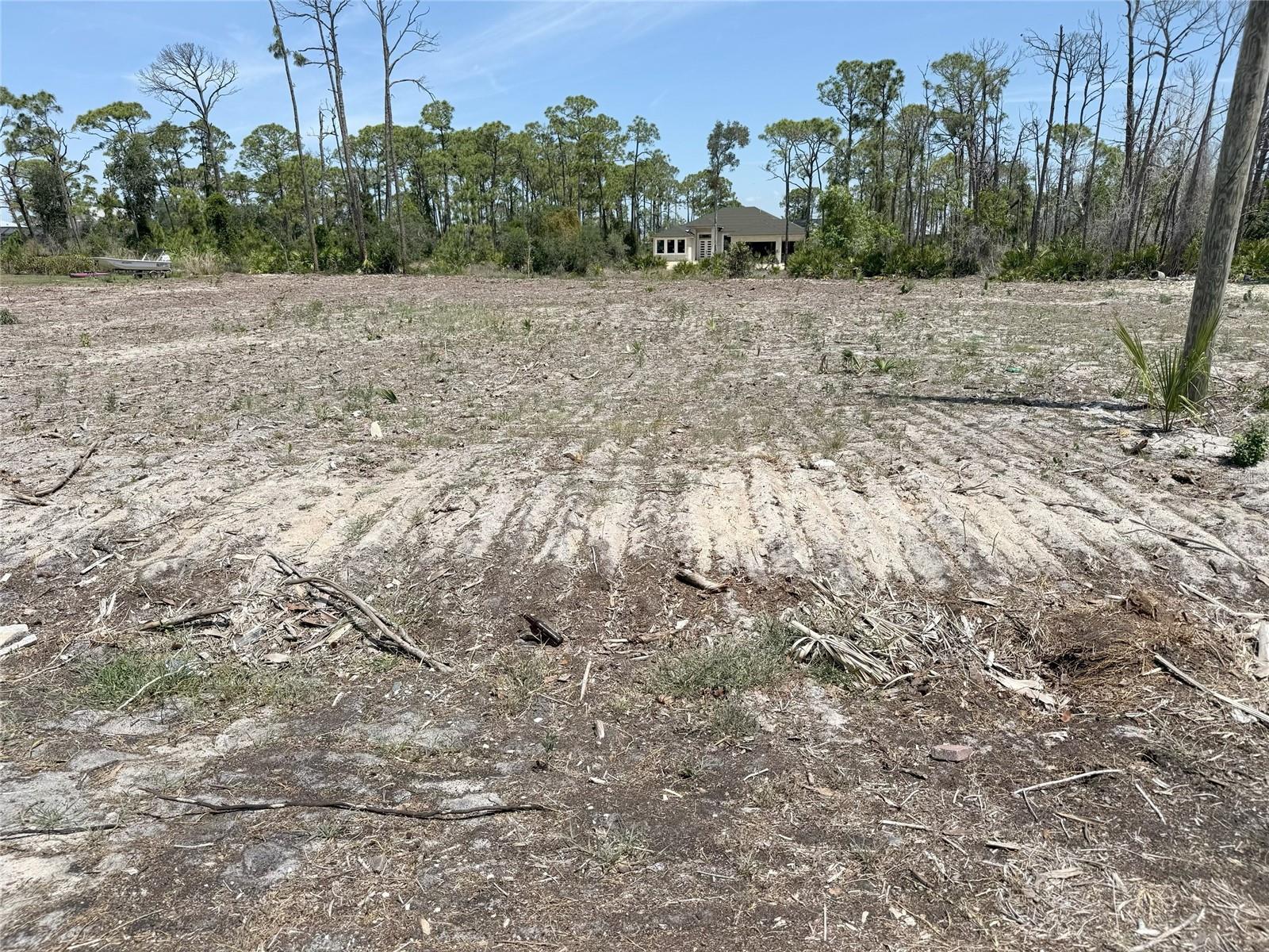 Welcome to 1890 Virginia Ave in beautiful Englewood, Florida. This cleared oversized corner parcel offers approximately 0.64 acres in the desirable Lemon Bay Islands / Whispering Pines area. The land has been cleared allowing you to fully appreciate the scope, size, and potential of this exceptional homesite. Ideally located just minutes from Englewood Beach and only one minute from Ainger Creek Park public boat ramp, you’ll enjoy quick access to Lemon Bay, boating, fishing, and all the Gulf Coast lifestyle has to offer. Conveniently located near Publix, shopping, dining, and local attractions, this property combines privacy with accessibility. Opportunities like this are rare one of the very few oversized parcels available this close to the Gulf, surrounded by beautiful homes. Build your dream home on this private 0.64-acre retreat and enjoy the best of coastal living in Englewood.