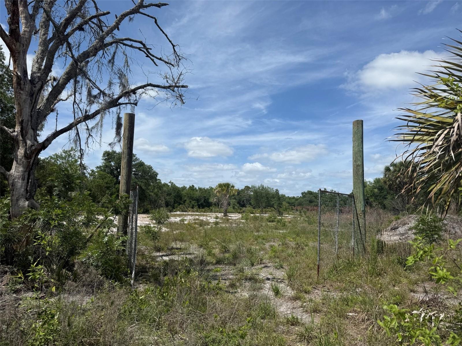 Build your dream home or invest in land with this beautiful 1.25-acre parcel located in Okeechobee. This property is cleared and ready for your vision, saving you time and money on prep work. Fully fenced for added privacy and security, it’s perfect for a homesite, weekend getaway, or future investment. A culvert is already in place, providing convenient access to the property. A survey is available, giving you added confidence and clarity when planning your build. Enjoy the peaceful surroundings while still being within a short drive to town amenities, shopping, and dining. Don’t miss this opportunity to own a ready-to-go piece of land in a growing area—bring your plans and make it yours! Buyer to perform their own due diligence regarding utilities, zoning, and land use.