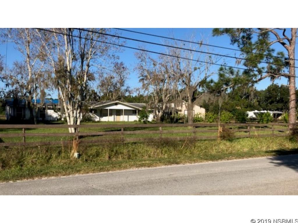 Amazing Estate Property Impeccably maintained  situated on 6.5 beautiful acres. Main roof of home scheduled to be replaced ASAP. Gated entry, two car garage and covered carport. Huge Barn plus huge Pole Barn. Two pastures. Endless possibilities! Come take a look today!
