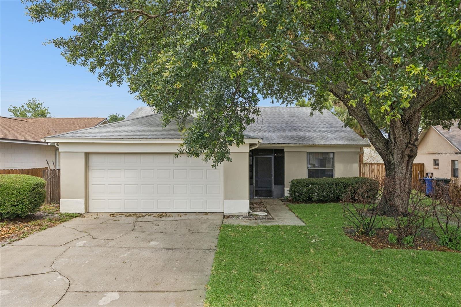 Welcome home to one of the least expensive homes in the Oviedo school district.   This 3 bedroom 2 bath home features an open floor plan with all tile and wood laminate floors - No carpet in the home.  The split bedroom plan is great for families.  The back yard is large and fully fenced.    The home has been freshly painted both inside and out in the last 30 days and had a new roof installed in 2020.    Located in the great community of Alafaya Woods you get the amazing schools and great family location close to everything.