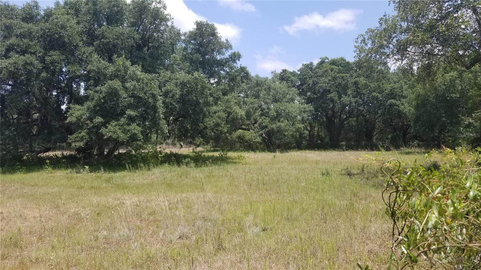Beautiful wide open view lakefront lot in Deed Restricted Rotonda Heights. The long, open lakefront view is magnificent, and if you require further space, the adjacent, oversized corner lot is also currently available. New construction all around, and this is one of the lowest priced lakefront lots anywhere throughout Englewood. Only minutes from the gulf beaches of Boca Grande/ Englewood, the building site offers both public water AND sewer, and less than 5-minute drive to everything Englewood has to offer. Lot also has been recently cleared, and ready to build on without costly clearing required. Great value!