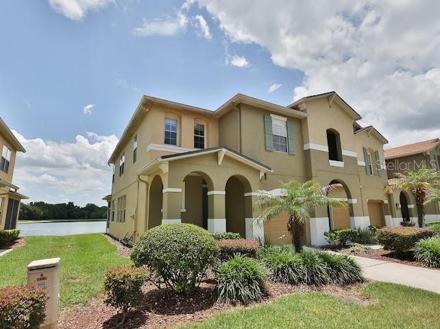 Stunning corner-unit townhome at 3893 Gliding Place in the gated Sanford community, The Preserve at Eagle Lake! This bright 3BR+LOFT/2.5BA home offers 1,774 sq ft of open-concept living space with spectacular, unobstructed waterfront views. The main level features ceramic tile floors throughout and large picture windows that flood the home with natural light. The gourmet kitchen boasts 42” cabinets with crown molding, stainless steel appliances, pendant lighting, and a massive walk-in pantry with under-stairs storage. Step outside to your private screened lanai to enjoy peaceful lake views.All bedrooms and a versatile loft—perfect for an office or second living space—are located upstairs. The primary suite is a true retreat with a walk-in closet, stunning water views, and a deluxe bath featuring a soaking tub, walk-in shower, and raised vanity. Bedroom 2 also includes a walk-in closet near an upgraded guest bath. Features an upstairs laundry room with washer/dryer included, and a 1-car garage with opener. New Roof (2021), New Exterior Paint (2021), and New AC (2024).Step directly outside to the scenic sidewalk/walking path that wraps around the lake right behind the house. This gated community offers resort-style amenities including a sparkling pool, playground, and ample guest parking. Prime Sanford location close to shopping, dining, and major highways. Turnkey and move-in ready!