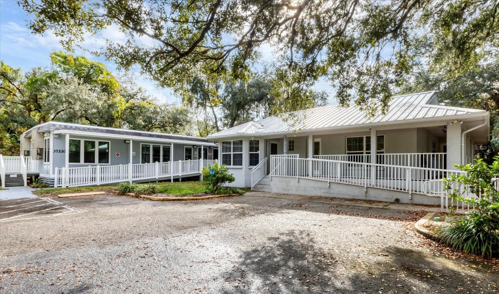 Great location  in the heart of Myakka City for this well appointed commercial complex.  There are 4 parcels included in this sale.  The main building was a real estate office and has 2 separate addresses with 2 separate bathrooms for the potential of 2 leases. In the main office building, there is a reception area, a large office area for muiltiple desks, a conference room and an additional private office. The 2nd building was used as a medical office and could be modified for other uses. It has 3 eamination rooma, business office and 2 bathrooms.  The 3rd building has metal sides and has been used for storage. 2 wells on this property.l  
This property can be seen directly from State Road 70. The configuration of the buildings offers flexibility for multiple tenants or departments.  High visibility to State Road 70 and high traffic area of Myakka. These properties have the potential for a commercial or business presence in a growing ruaral market where business meets small town charm. The limited business areas in Myakka make this