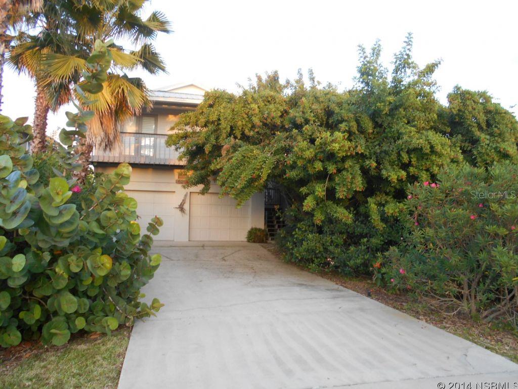 Ocean view beach home with many upgrades.  Plantation shutters and Bamboo flooring. The master bathroom has double sinks with granite counter tops and tiled floor. Living room has a tile floor, vaulted ceiling and a gas fireplace. Professional gas stove with hood, GE Monogram refrigerator (SS), pantry and French doors leading out to West kitchen. French doors lead out to East deck with Plantation shutters. Crown molding, metal roof. Widows walk has beautiful breathtaking views. Nice deck out back for relaxing. Back deck goes from the ground level up steps to the 2nd floor and widows walk. Wired for surround sound system. Bring your toys to the beach. First floor has oversized garage with a full bathroom and bedroom. Water heater is a gas tankless. ;Water: City
