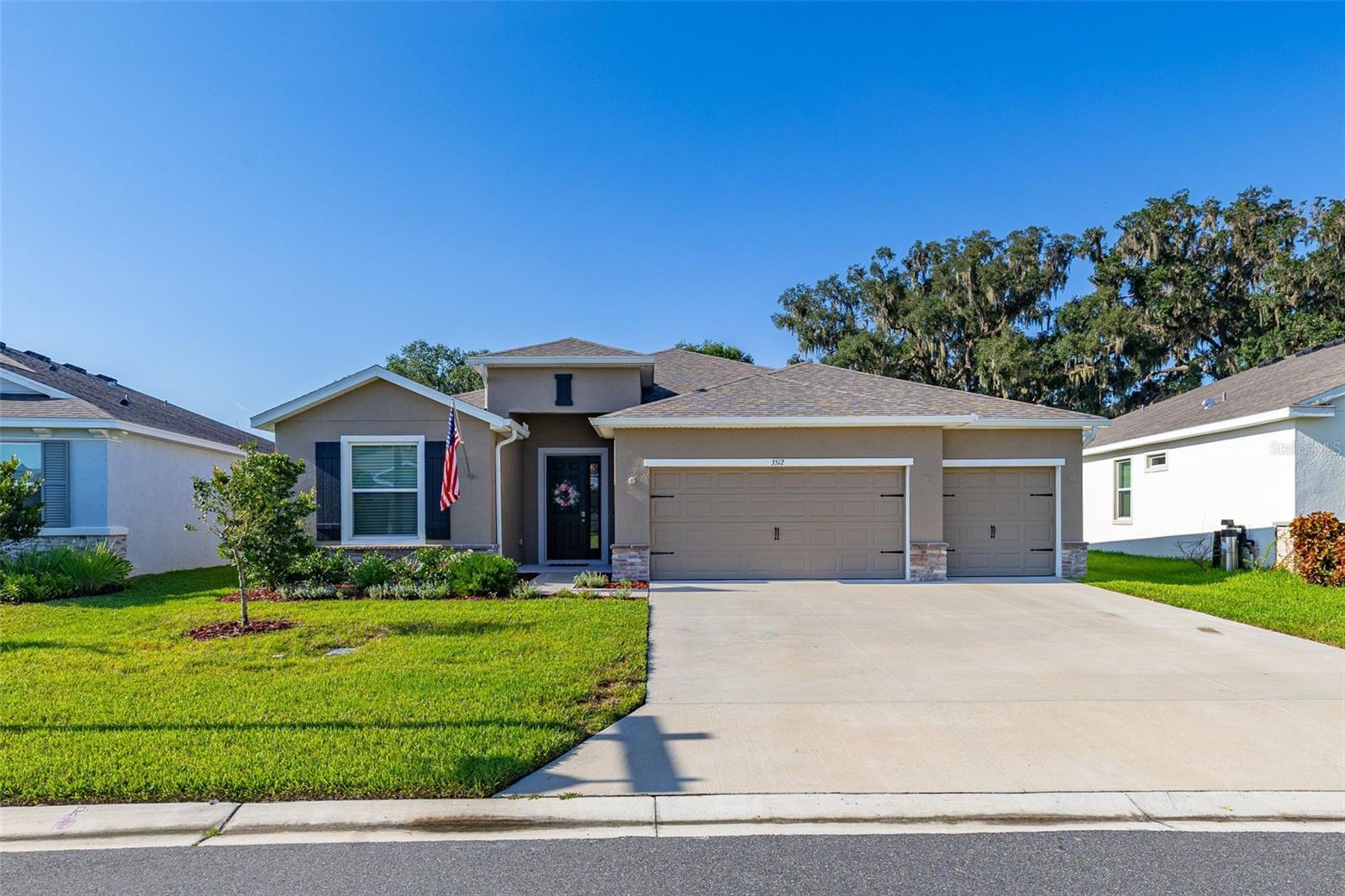 Welcome to this beautifully designed 2024 DR Horton Hawthorne model in the sought-after Farm at Varrea community in Plant City! Offering over 2,500 square feet of thoughtfully designed living space, this one-story home features 4 bedrooms, 3 full bathrooms, and a 3-car garage, providing the perfect combination of comfort, style, and functionality.

Step inside to discover an open-concept floor plan filled with natural light, luxury tile flooring throughout the main living areas, and a spacious great room that flows seamlessly into the gourmet kitchen. The kitchen is a true centerpiece with granite countertops, a large island with seating, stainless steel appliances, abundant cabinetry, and a walk-in pantry—ideal for entertaining or everyday living. The split-bedroom layout offers privacy, while the expansive owner's suite features a tray ceiling, oversized walk-in closet, dual vanities, a garden tub, and a separate walk-in shower.

Enjoy Florida living year-round from the Florida room overlooking a fully fenced backyard with peaceful views and no direct rear neighbors. Located in the amenity-rich Farm at Varrea community, residents enjoy a resort-style pool, clubhouse, fitness center, playground, walking trails, and scenic green spaces. Conveniently situated near I-4, shopping, dining, and everything Plant City and Tampa have to offer, this nearly new home is move-in ready and waiting for its next owner!