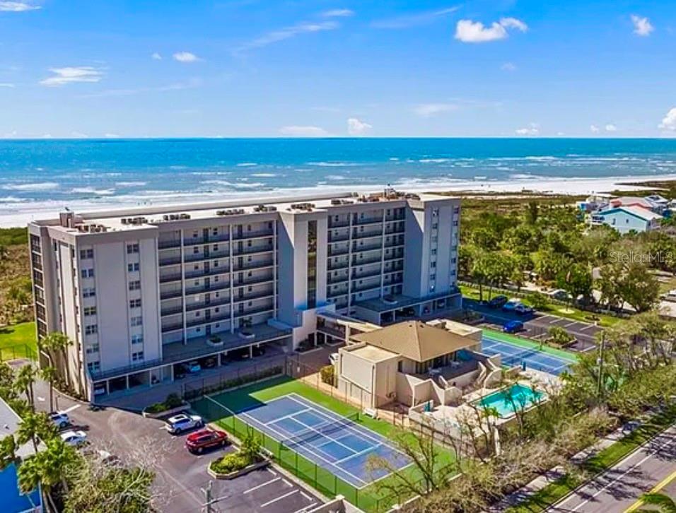 This Rare Beachfront, Classic Coastal Modern extensively renovated 2/2 condo has your Dream View! Unobstructed Beach View of 400’ of private beach on 7 acres.
Offering total building area for unit is 1568 sq ft. Modern appointed living area is 1316sq ft with additional 252 sq ft Modern Private Lanai.
High demand all year Monthly (12) rentals for Investor, 2nd Home or Primary Home.
There are No assessments. Passed Structural Integrity. Strong, Fully Funded Reserves. Replaced cast iron to New “PVC” drains in entire building, New building roof, New clubhouse roof lowered insurance master policy.
Stilted Building, Designated Parking underneath. Gated with 24 Hr Security.
Condo has Brand New HVAC 2026 with R454B gov. required cooling & New Water Tank.
Designed by Owner, Floor to Ceiling integrating a cohesive Classic Modern Art Gallery feel throughout. Enjoy your “private outdoor living” new screened 31’x8’ Beach Lanai (no houses/buildings in line of sight) Modern flooring, locking storage Door. Condo is insulated & extremely “Quiet” w/updated PGT impact Sliders and Windows. Solar Shades are see-through when down on sliders but front windows have see-through Solar Shades & Privacy Shades. The Front has Quiet Solid Core Impact Door. Wi-Fi Thermostat. Stunning Modern Polished Porcelain, Large Rectified 24” Tile for entire condo & closets. Modern Frosted Glass Framed Solid Wood 4 Interior Doors.  Frosted Glass Framed Solid Wood Interior Bifolds for all 7 closets, continuing a clean line design with 8” Solid Wood, Mitered Baseboards throughout. Calming Lighting with all LED lighting dimmers throughout & all walk-in closets. All Closets designed w/Solid Wood Shelving & fitted w/thick satin nickel Rods and Brackets to All Studs for Heavy organization needs. Both Bathrooms have Moreno Gloss Floating Soft Close Drawer Vanities w/satin nickel Series Pfister Kenzo Waterfall Faucets/Shower Handel & 4 piece Towel bar set. Kohler Skirted “Chair-Height” Toilets for both. Main bath is Designed w/24” Italian Carrera Marble Tile, full size Bench & tall Niche. Guest bathroom Designed w/24” Ivory Glass Tile & Tall Abalone Tile Niche. With owners not being a chef/cook, kitchen is gently used in immaculate condition. ALL "SMART Wi-Fi" Stainless Appliance Suite, Largest Size features; “Double Oven” 5 burner w/Warming Drawer. Refrigerator “Showcase” Triple French Door, ice/water, Middle Flex Drawer, Bottom Freezer Double Drawer. Stainless “Triple Storm” Dishwasher. Kohler 36” Large Stainless Steel Apron Sink w/Kohler Pull down Stainless Faucet. Matching to Suite are Over Size Stainless "Wi-Fi" Front Load Washing Machine & Front Load Dryer on Stainless Pedestals in “walk-in” Laundry Room, stainless light, solid wood shelving w/nickel stainless rod/brackets designed for Heavy storage needs. Owner has variety remodeled Product in front closet. This beachfront condo has been gently lived in and all the Design Aspects/Appliances are in Immaculate Condition. Clubhouse w/ 25‘x40‘ Heated Swimming Pool, Tennis & Pickleball Courts, updated Fitness room, bathrooms, your private locked Storage Room. Private Beach gate to Boardwalk w/ picnic area, 2 grills & birdwatching benches. Pet friendly, designated large pet park w/bench.

“Private ISLAND Style Living”
A truly Coveted Opportunity awaits you-
private, unobstructed view, full condo length beachfront lanai, 6 floor, 7 acre property & 400’ beachfront.

Property is available for Same Day Showings.