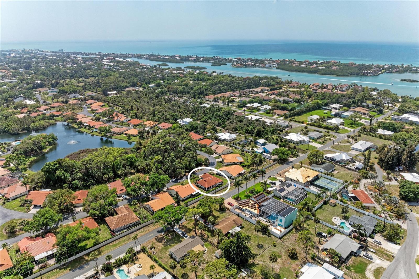 ** Just Reduced $10,000 Off Your Dream Home! ** Welcome to your very own coastal retreat in the heart of Nokomis! This 3-bedroom, 2-bathroom home offers a perfect blend of comfort and seaside tranquility, just 1.4 miles from the world-renowned Nokomis Beach and Casey Key. This exclusive residence is move-in ready and designed to impress offering freshly painted bedrooms and a newly updated lanai screen that invites you to relax in style, while the cathedral ceilings and luxurious hardwood floors throughout add a touch of elegance. The master suite is a true sanctuary, featuring the same stunning hardwood floors that flow seamlessly into the guest bedrooms, ensuring every inch of this home radiates quality and charm.

Enjoy peace of mind with a durable tile roof installed in 2019 and a brand-new water heater as of January 2024. Step outside to the expansive lanai, a perfect space for relaxing, entertaining, or simply soaking up the Florida sunshine year-round. The neighborhood welcomes you with mature oak trees lining the entryway, setting the tone for the tranquil lifestyle that awaits. Laurel Hollow is a pet-friendly community with warm, welcoming neighbors and a serene lake complete with fountains—ideal for birdwatching or fishing. Residents also enjoy access to a heated community pool and a cabana overlooking the lake, perfect for gatherings with friends and family.

Located right next to Nokomis Beach and Casey Key, this home offers unparalleled access to the best of coastal living. Walk or bike to the beach in minutes, or explore nearby Venice and Sarasota, both brimming with cultural attractions, boutique shopping, and charming sidewalk cafes. Outdoor enthusiasts will love the proximity to The Legacy Trail, numerous golf courses, and several stunning beaches, including Venice Beach, Manasota Key Beach, and Brohard Beach & Paw Park for your furry friends. Everyday conveniences like Publix, ALDI, Starbucks, banks, pharmacies, restaurants and top-rated schools are just a short walk or drive away.

 Low HOA fees, no CDD fees, and a pet-friendly neighborhood make this a rare opportunity to own your slice of paradise right by the beach. Don’t wait—start living your dream today!