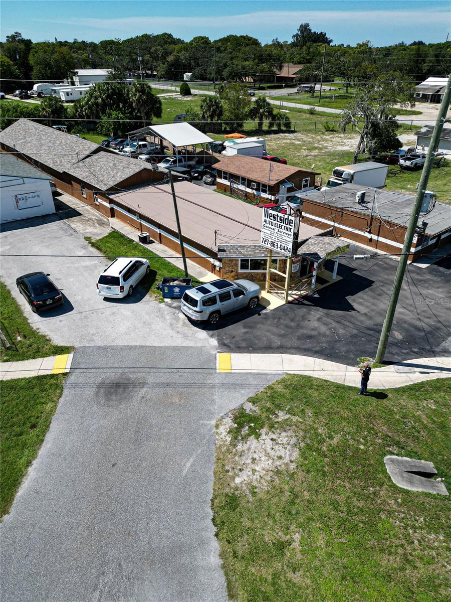 PRIME COMMERCIAL LOCATION ON US-19 - OWNER FINANCING OPPORTUNITY! Exceptional opportunity featuring multiple buildings on 0.64 acres with approximately 100 feet of high-visibility US-19 frontage. Located in a C-2 zoning district, this offering includes two parcels sold together: • Parcel #27-24-16-0010-00B00-0050 • Parcel #27-24-16-0010-00B00-0060 Property addresses: 14821, 14825, & 14827 US-19, Hudson, FL. The property includes multiple bay spaces, currently suitable for automotive-related use, with the flexibility to be repurposed for a wide variety of commercial businesses. A large rear parking area provides ample space for customer parking, employee parking, fleet vehicles, or additional operational needs. The site benefits from approximately 39,500 vehicles per day, offering outstanding exposure along a major commercial corridor. Multiple businesses currently operate on the property, providing income potential and versatility for investors, owner-users, or redevelopment. Owner financing available, making this a rare and attractive opportunity for qualified buyers. Endless possibilities in a high-traffic location. DO NOT approach owners or employees.