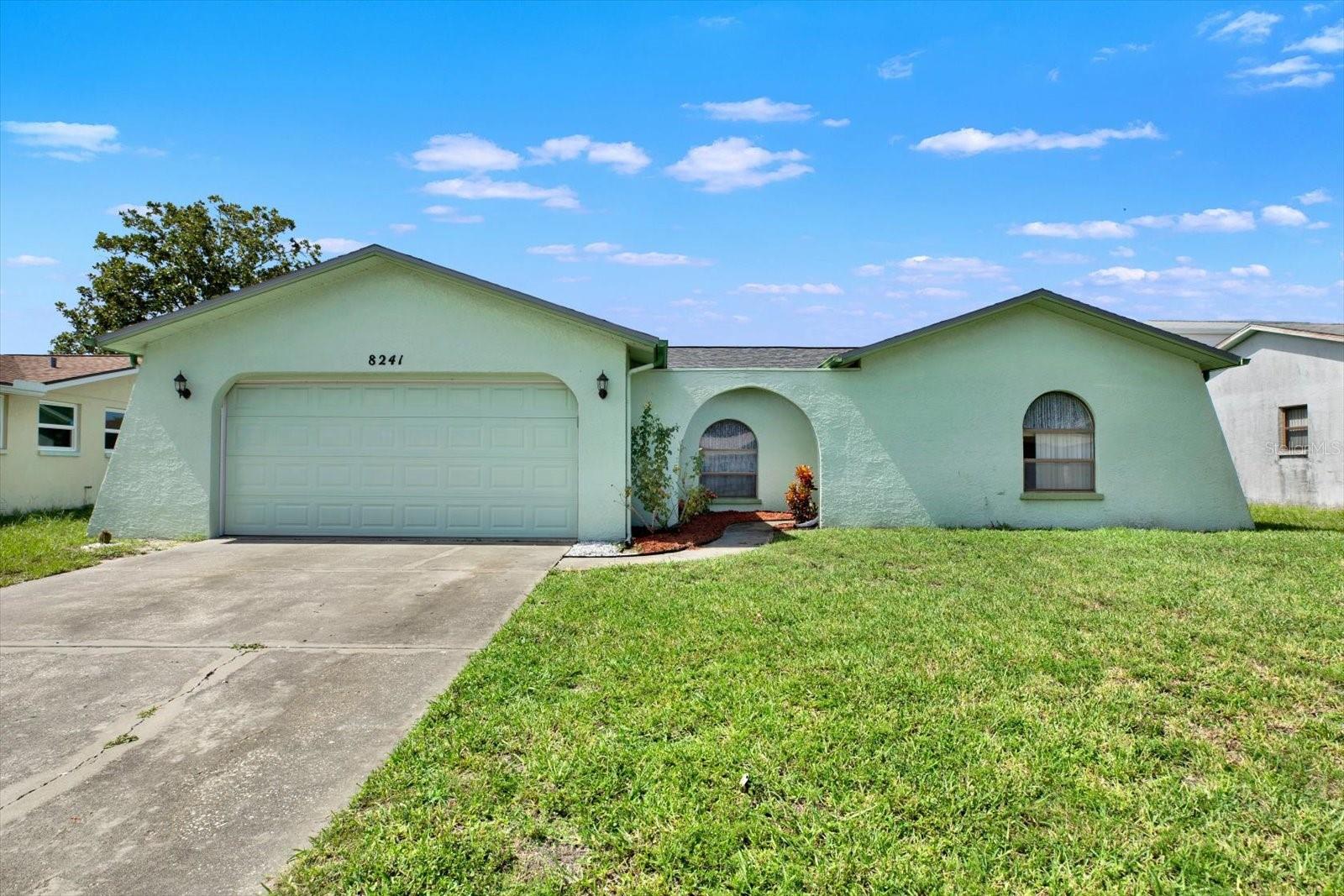 Virtually Staged. Move-In Ready! Major Updates Already Done – No HOA & No Flood Insurance Required! If you've been searching for a home where the expensive updates have already been completed, this is the one! Welcome to this beautifully maintained 2-bedroom, 2-bath home offering 1,124 square feet of comfortable living space and a 2-car garage. Whether you're looking to downsize, purchase your first home, find the perfect winter retreat, or add a solid investment property to your portfolio, this home is move-in ready. Enjoy peace of mind with numerous recent upgrades, including: Brand-new roof (2026) with a transferable 50-year warranty, New patio door (2026), New front screen door 2026), A/C replaced in 2021, Water heater replaced in 2022, New vinyl flooring, New interior doors, Newer stainless-steel kitchen appliances, Newer kitchen cabinet refacing.  With so many major improvements already completed, you can focus on making this home your own instead of worrying about costly repairs. One of the biggest advantages? No HOA and no flood insurance required, helping keep your monthly expenses low while giving you the freedom to enjoy your property without additional fees or restrictions. Conveniently located near shopping, grocery stores, restaurants, banks, hospitals, and schools, this home also offers easy access to several local and state parks for outdoor recreation. Plus, Tampa International Airport is only about 45 minutes away, making travel simple and convenient.  Don't miss this exceptional opportunity to own a well-cared-for home with the updates buyers are looking for. Schedule your private showing today!