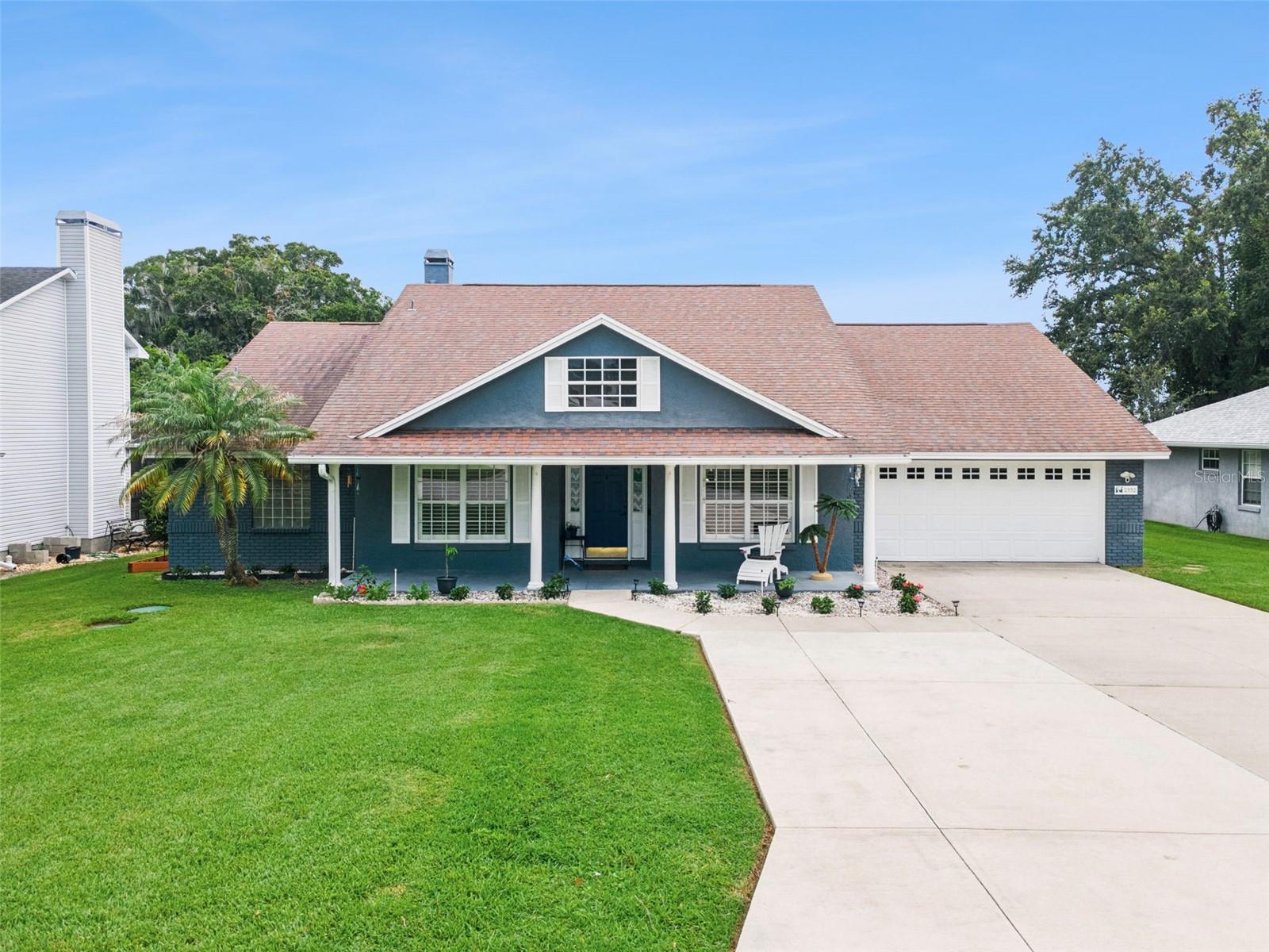Welcome to 2352 Miles Ct, a move-in ready South Lakeland pool home offering a spacious layout, numerous upgrades throughout, and a large outdoor living area. Located in the Country Crossing community, this single-story residence features 1,965 sq ft of living space with 3 bedrooms, 2 full bathrooms, and a two-car garage. The home welcomes you with beautiful landscaping, an extra-wide driveway, and a covered front porch. Inside, the split-bedroom floor plan provides both privacy and functionality. A formal dining room offers space for hosting, while a separate flex room with French doors can be used as a home office, playroom, sitting room, or additional living area. Crown molding, plantation shutters, and hard-surface flooring throughout add to the home’s cohesive design. The kitchen serves as the center of the home, featuring granite countertops, stainless steel appliances, a tile backsplash, breakfast-bar seating, abundant cabinetry, and a breakfast nook overlooking the pool area. The kitchen opens to the family room, where a wood-burning fireplace with built-in shelving creates a comfortable gathering space. The primary suite features a tray ceiling, direct access to the pool, two walk-in closets, and an en-suite bathroom with separate vanities, a garden tub, a tiled walk-in shower, and a private water closet. Two additional bedrooms with walk-in closets and a full guest bathroom are located on the opposite side of the home. French doors lead to the expansive screened outdoor area, featuring an in-ground pool with an attached spa, brick-paver decking, and a large covered lanai with plenty of room for dining, grilling, relaxing, and entertaining. Mature landscaping along the rear of the property provides added privacy around the pool area. Additional upgrades include a new HVAC system, and an interior laundry room with a utility sink. Conveniently located near shopping, dining, schools, and major roadways, this South Lakeland pool home offers a functional layout, updated major systems, and an outdoor space designed for Florida living. Schedule your private showing today.