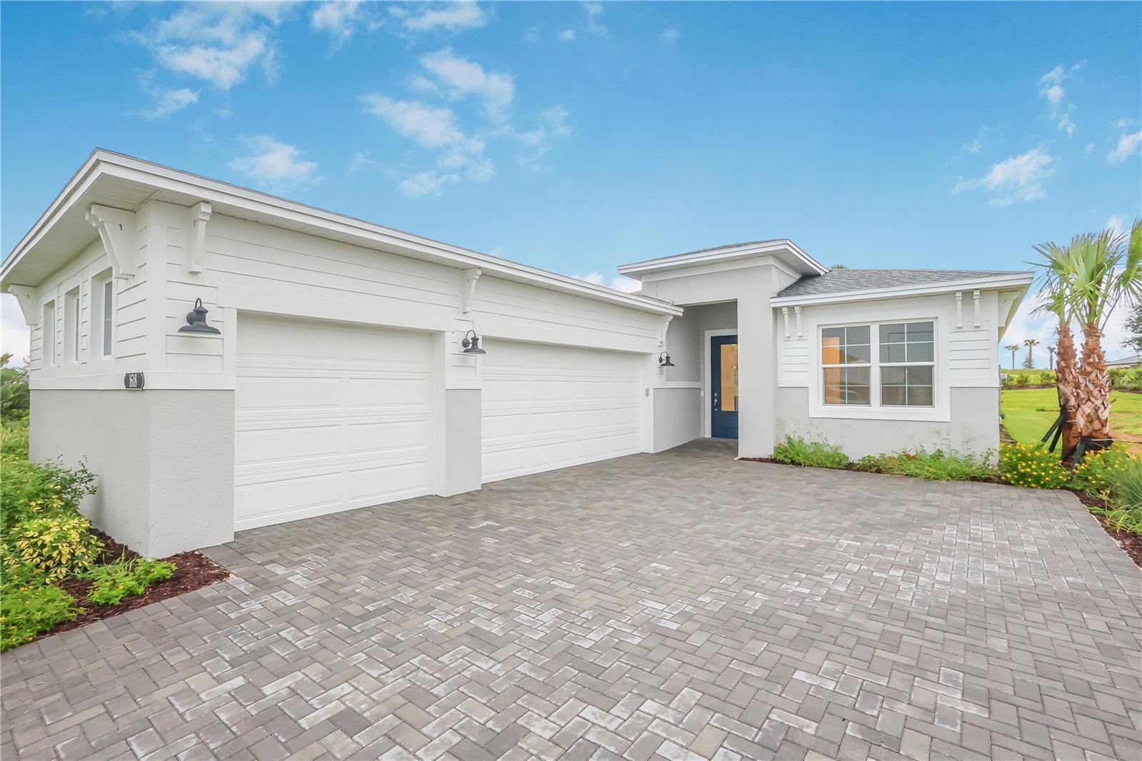 Designed with today’s discerning buyer in mind, this move-in ready residence showcases timeless architectural design and modern luxury in every detail. Featuring 3 spacious bedrooms and 3 beautifully appointed, spa-inspired bathrooms, The Laura provides over 2,100 square feet of meticulously planned living space—ideal for families, professionals, and anyone seeking comfort and style. The centerpiece of the home is the gourmet kitchen, crafted for both functionality and elegance. Enjoy preparing meals with premium stainless steel appliances, including a wall oven, gas cooktop, and an efficient chimney-style exhaust hood. Frameless European-style cabinetry with upgraded large crown molding offers abundant storage and a contemporary look, while the 24” deep cabinet above the refrigerator with a side panel provides extra convenience. The kitchen is adorned with stunning 3cm luxury veined quartz countertops and an artisan tile backsplash, perfect for both daily living and entertaining guests. he Owner’s Suite is a true retreat, featuring a luxurious extended shower with a frameless glass enclosure, upgraded stone mosaic tile flooring, and both a standard and handheld showerhead with a slide bar. All bathrooms include upgraded plumbing fixtures and tile that extends to the ceiling, providing a spa-like atmosphere. The home’s main living areas are finished with elegant 12x24 porcelain tile, while the Owner’s Suite and flex space feature stylish laminate plank wood flooring for warmth and durability. Additional features include 16’ sliding glass doors leading to a tranquil covered lanai—ideal for year-round outdoor enjoyment—as well as sophisticated matte black designer hardware on all interior doors. Residents of Cresswind at Lake Harris enjoy exclusive amenities, including 8 championship pickleball courts, a grand clubhouse with state-of-the-art fitness center, a resort-style swimming pool with lakefront views, and marina access to the pristine Lake Harris. Nestled on a peninsula in between Lake Harrs and Lake Dora, this location puts you right in the center of the Chain Of Lakes area and all it has to offer. Experience privacy, security, and an active lifestyle in a highly desirable location. Club Cresswind will overlook the lake and feature a wide range of indoor and outdoor amenities such as Cresswind SmartFIT Training Center powered by EGYM. Experience elevated living in The Laura, an exceptional new construction home in the coveted Cooper Collection. To learn about all the ways you can have this home, contact a Cresswind at Lake Harris New Home Guide.