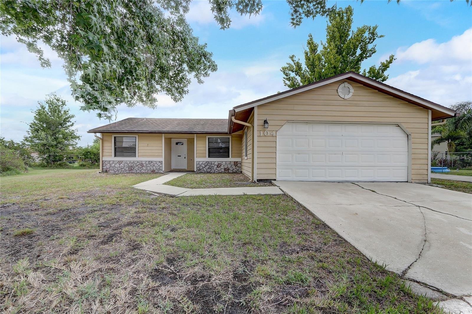 Welcome to 104 Turin Way, Kissimmee—a beautifully updated 3-bedroom, 2-bathroom home tucked away at the end of a quiet cul-de-sac on an expansive half-acre lot. This home features a desirable split floor plan, providing added privacy between the primary suite and guest bedrooms. Recent updates give the home a fresh, modern feel, while the BRAND NEW 2025 ROOF offers added peace of mind for years to come. Situated on a rare half-acre homesite, the property offers plenty of space for outdoor entertaining, gardening, recreation, or simply enjoying the privacy of a large backyard. Ideally located just a short drive from Walt Disney World Resort and other world-famous Orlando attractions, including Universal Orlando Resort and SeaWorld Orlando, you'll enjoy convenient access to premier entertainment, shopping, dining, and major highways while still coming home to a peaceful residential setting. Whether you're searching for a primary residence, vacation home, or investment property, this move-in-ready home offers the perfect combination of modern updates, generous outdoor space, and an unbeatable Central Florida location.