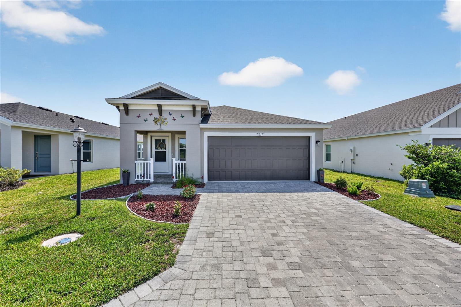 Better Than New - Why Wait to Build?
Skip the wait and move right into this beautifully upgraded, just one-year-old home that offers all the benefits of new construction- plus thousands of dollars in premium upgrades already completed!
From the moment you enter, you'll appreciate the spacious foyer and soaring vaulted ceilings that create a bright, open feel. The thoughtfully designed kitchen is a standout, featuring elegant quartz countertops, a stylish tile backsplash, soft-close cabinets and drawers, crown molding on the cabinetry, and a generous pantry for added storage.
Throughout the home, you'll find durable laminate flooring, custom window blinds, and smart home features that add comfort, convenience, and efficiency. Step outside to enjoy the enclosed lanai overlooking the fully fenced backyard, professionally landscaped for beauty and privacy- perfect for relaxing or entertaining.
Located in a growing community where new construction is still underway, this home offers the advantage of moving in now while benefiting from exciting future amenities, including a community dog park and recreation center coming soon. Enjoy a low HOA and a convenient location just minutes from grocery stores, medical offices, restaurants, shopping, and everyday essentials.
Why pay extra for builder upgrades or wait months for construction when this home already has it all? This move-in-ready gem combines modern style, quality finishes, and exceptional value in one incredible package.
Schedule your private showing today and discover why this better-than-new home is the perfect place to call your own!