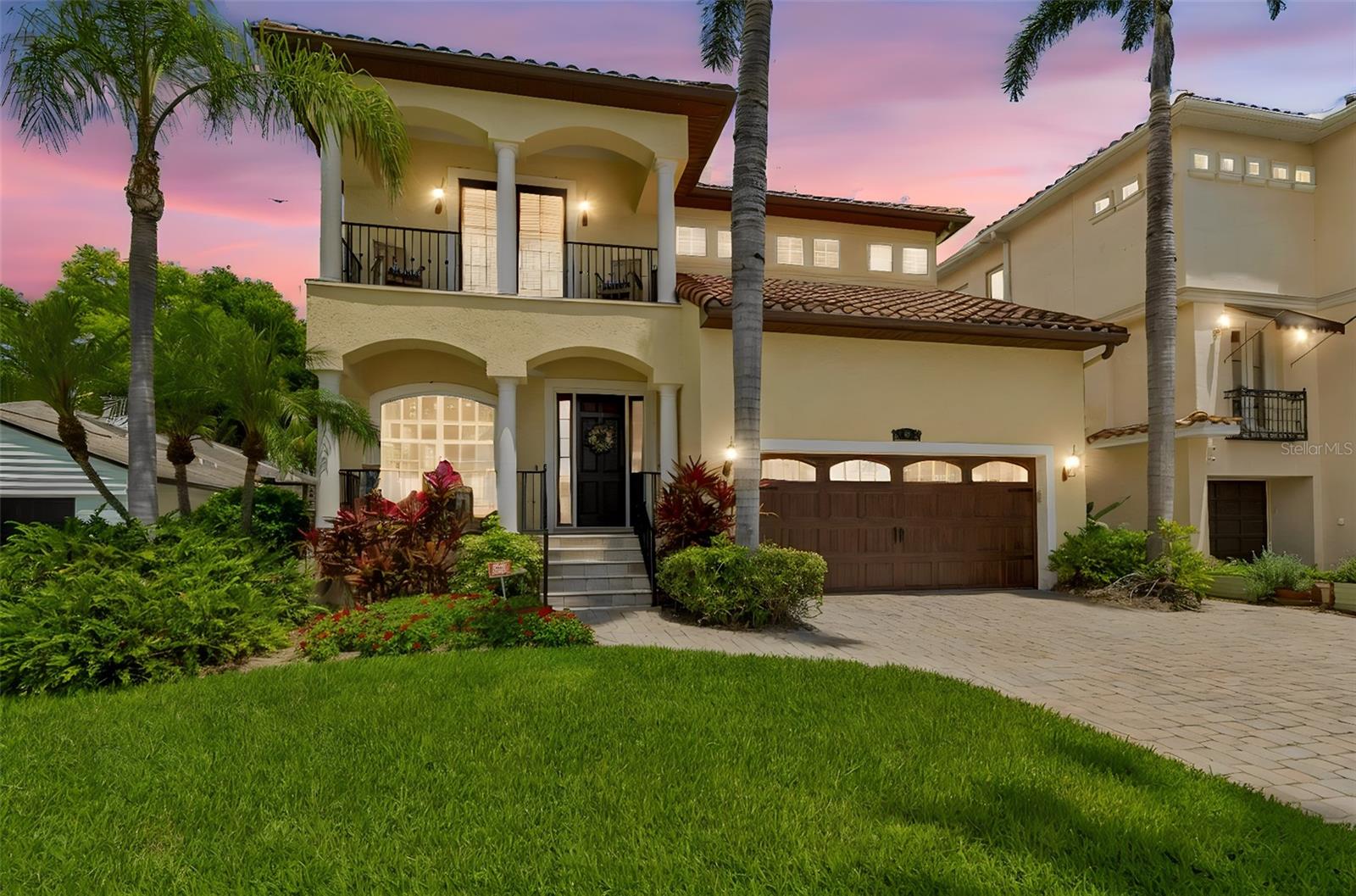 Welcome to 107 Bermuda, a beautifully crafted custom-built residence located in one of the most desirable pockets of Davis Islands. Surrounded by upscale homes and lush tropical landscaping, this home blends timeless Mediterranean-inspired architecture with an exceptional layout.

Offering 4 bedrooms and 3.5 bathrooms, and expansive living spaces throughout, the home is thoughtfully designed with flexibility and functionality in mind. The main level features formal living and dining rooms, a gas fireplace, an oversized chef’s kitchen with abundant gathering space, stainless steel appliances, handcrafted cabinetry, and natural stone finishes throughout. There is additional office/flex space on the first floor. 

Upstairs, the oversized primary suite offers custom built-ins, separate walk-in closets, a soaking tub, enclosed walk-in shower, dual vanities, and a private balcony. One secondary bedroom functions as a junior suite with its own ensuite bath, while the remaining bedrooms are thoughtfully arranged (jack and jill) for privacy and comfort. An upstairs laundry room adds everyday convenience.

Outside, the pool, spa, and summer kitchen are framed by lush palms and mature landscaping. 

Located just moments from Downtown Tampa, Water Street, Bayshore Boulevard, Tampa General Hospital, and the shops and restaurants of Davis Islands Village, this exceptional property offers the perfect balance of island tranquility and urban convenience.