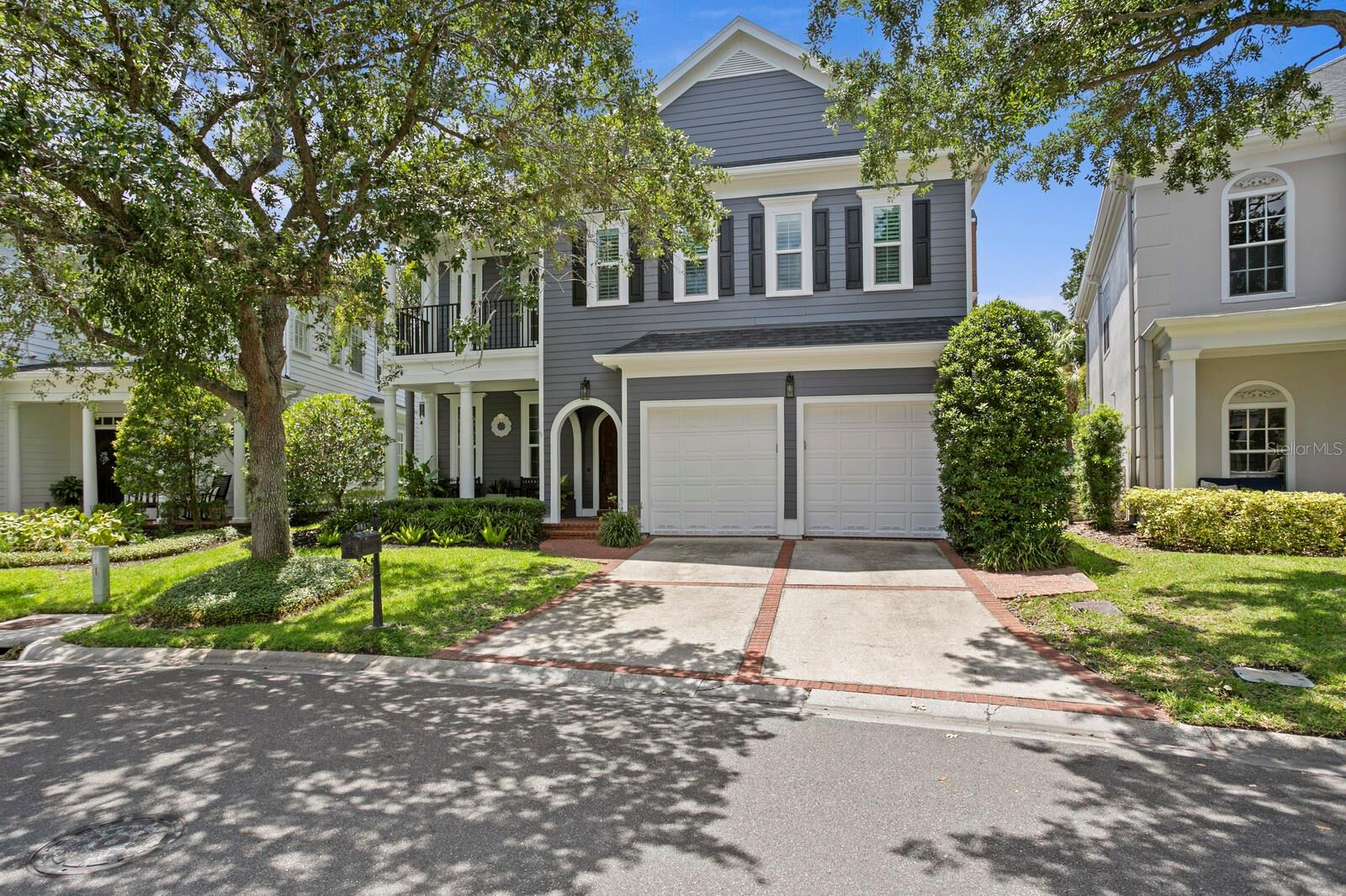 A truly magnificent single-family home has arrived on the exclusive enclave of Harbour Island. This premier detached residence stands out by featuring one of the two largest lots in the Harbour Bay Homes community, rewarding you with an exceptionally generous outdoor footprint and standalone independence. Nestled behind 24-hour manned security gates, this home offers the ultimate Harbour Island lifestyle: a private retreat that perfectly balances vibrant city living with a quiet, peaceful escape. Here, you can immerse yourself in the middle of downtown Tampa's premier dining and entertainment, then effortlessly return home to absolute serenity. Pass through the exquisite teak wood front door into a fully modernized interior boasting a 2024 ROOF featuring a premium full peel-and-stick underlayment, two 2x4' off-ridge vents, and two solar-powered ventilation fans, alongside a whole-house water filtration system, a tankless water heater, and dual HVAC zones. The newly transformed interior showcases all-new wood floors spanning both levels, an elegant gas fireplace, and stunning ceiling beams in the family room. Ideal for hosting, the main level features a custom built-in entertainment center, a bonus/flex room with custom built-ins, and a dining room serving station with a dedicated Sub-Zero wine refrigerator. The elite epicurean kitchen comes fully reimagined with custom cabinetry, a top of the line Sub-Zero refrigerator, two new dishwashers for effortless hosting, and a magnificent new 6-burner Thermador gas range, further elevated by a prep sink, quartz countertops, a walk-in pantry, and an oversized island. Upstairs, the expansive primary suite offers an oversized walk in closet, private primary bath with soaking tub and dual sinks, and a balcony that overlooks serene, lush, mature landscaping.  The remainder of the upper level has a Jack-and-Jill bathroom connecting two spacious bedrooms, alongside a  third bedroom featuring its own dedicated bathroom. Step outside to your backyard that stands out as it backs up to a peaceful greenbelt for privacy and features an outdoor kitchen, low maintenance luxury turf, and room for a future pool, complemented by an outdoor gas fire pit. For ultimate peace of mind, the property is equipped with all NEW PGT VINYL IMPACT 5500 SERIES HIGH IMPACT WINDOWS AND GLASS DOORS WITH A LIFETIME WARRANTY throughout the home for premium safety, energy efficiency and quiet interiors.  Enjoy this walkable waterfront lifestyle, located just a short scenic stroll from downtown Tampa’s best dining, entertainment, and waterfront paths, with a premium boat dock and lift available for separate purchase just a short walk from your home.