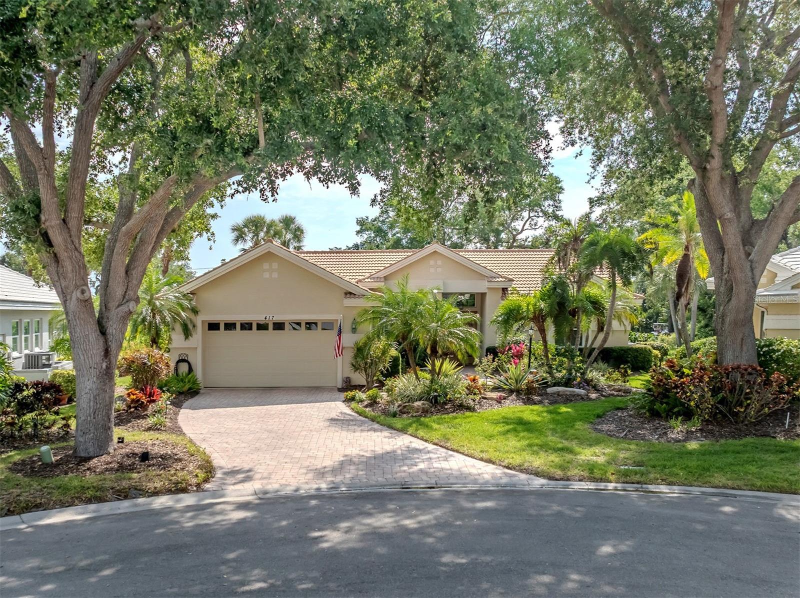 Experience the exceptional lifestyle of the Venice Golf and Country Club in this beautiful residence ideally positioned on a quiet cul-de-sac with breathtaking views of the pond, golf course and protected preserve beyond, without another home behind you. Enjoy carefree living, as this home has hurricane impact glass windows, lanai glass slider screen and shutters. Enjoy easy-living in a maintained neighborhood where your grass is cut, edged, mulched, landscaping trimmed and roof is power washed. A treasured golf membership opportunity is available as well. Lush tropical landscaping, a brick paver driveway and walkway and double-etched art glass entry doors create an elegant first impression. Inside, neutral 20-by-20-inch tile flooring flows throughout the living areas and den. The spacious great room is designed for seamless indoor-outdoor living, with four sliding glass doors opening to the partially covered, fully screened lanai complete with serene water and golf course views and a Storm Smart screen. High ceilings, crown molding and ceiling fans add to the home’s refined appeal. The light-filled kitchen features white cabinetry, quartz countertops and backsplash, breakfast bar seating and an adjoining dinette with cathedral ceilings and bay windows overlooking the picturesque setting. The primary suite is a peaceful retreat offering plantation shutters, crown molding, a large walk-in closet and an en-suite bath with dual sinks, a vanity area, a garden tub, a glass-enclosed shower and a private water closet. Two guest bedrooms share a Jack-and-Jill bath, while double pocket doors open to a versatile den with a built-in desk, cabinetry and shelving. Additional features include a well-equipped laundry room with a washer, dryer, cabinetry and utility sink, plus a two-car garage. The Venice Golf and Country Club has been recently reimagined. The expanded clubhouse features a spacious gathering bar, gourmet and commercial kitchens and a cozy fire pit. Members enjoy casual and special event dinners throughout the year. The new state-of-the-art wellness center offers massage therapy, fitness classes, yoga, physical therapy and personal training that provide a holistic approach to health and well-being. The beautifully renovated Ted McAnlis-designed 18-hole championship golf course is treasured and highly rated as one of the best and well-maintained golf courses in the region. Residents also enjoy Har-Tru tennis courts, bocce ball and a junior Olympic-sized pool and spa, balancing active living with relaxation. As a Geo-Certified Audubon Cooperative Sanctuary, VGCC embraces environmental stewardship and sustainability. With an A+ financial rating, the community is as solid as it is serene. Ideally just minutes from airports, shopping, dining, Interstate 75, cultural venues and Wellen Park is this charming home. It's also a short drive to the treasured Venice Island, where 14 miles of pristine beaches meet the sparkling Gulf Coast.
