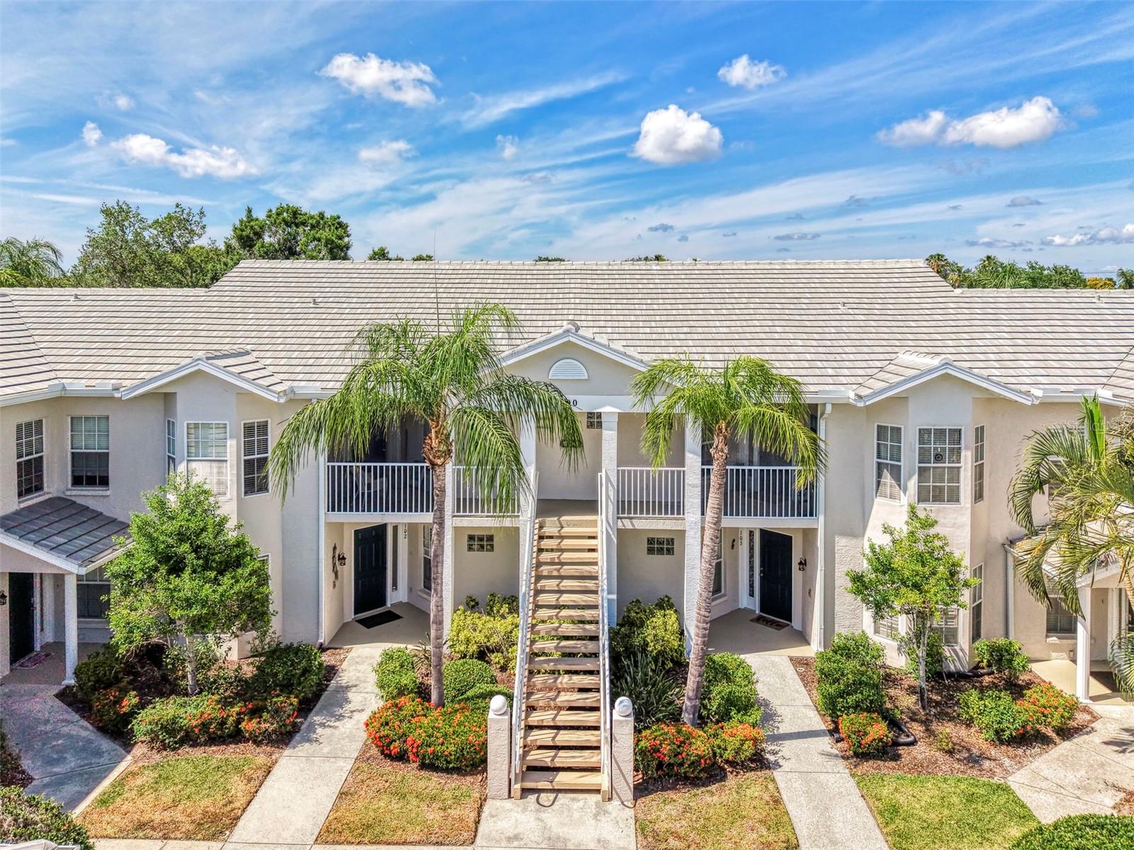 Appealing two bedroom, two bath, one car garage, second floor condo, in desirable Plantation Golf & Country Club. Your condo is located in the small, gated enclave, of West Lake Gardens of St. Andrews Park. The condo features cathedral ceilings in the main areas to give it an open, airy feel. It has a combination dining area and living room, leading out to the Florida Room, all with peaceful water views. The kitchen has a breakfast bar, eating space within it and a large closet pantry. Your master bedroom has a large walk-in closet. There is a separate laundry room.  You have two community heated pools to choose from to use and a clubhouse. Plantation Golf & Country Club membership is optional. Come see this great buy today!
