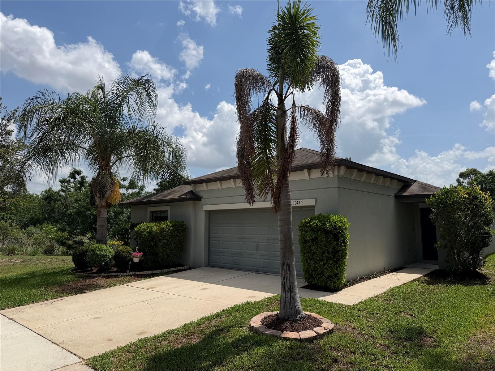 Beautiful 4 bedroom 2 bathroom home with a fenced yard and a 2 car garage. The homesite is very quiet and peaceful with woods behind the home and an open area on the left side of the home. No neighbor behind or on the left. This home is bright and open with 4 nicely sized bedrooms. The primary suite has dual vanity and a huge walk-in closet. The kitchen has a large island and pantry with plenty of wood cabinets, providing lots of working space and storage. The neighborhood has an amazing community pool for its homeowners with a beautiful lake and woods view. This home offers quick access to I-75, US 301, and all the restaurants and shopping venues you could want. Between Tampa, Bradenton, Sarasota, and St. Pete, there is an endless list of fun activities for everyone. Just painted and ready for a new owner.