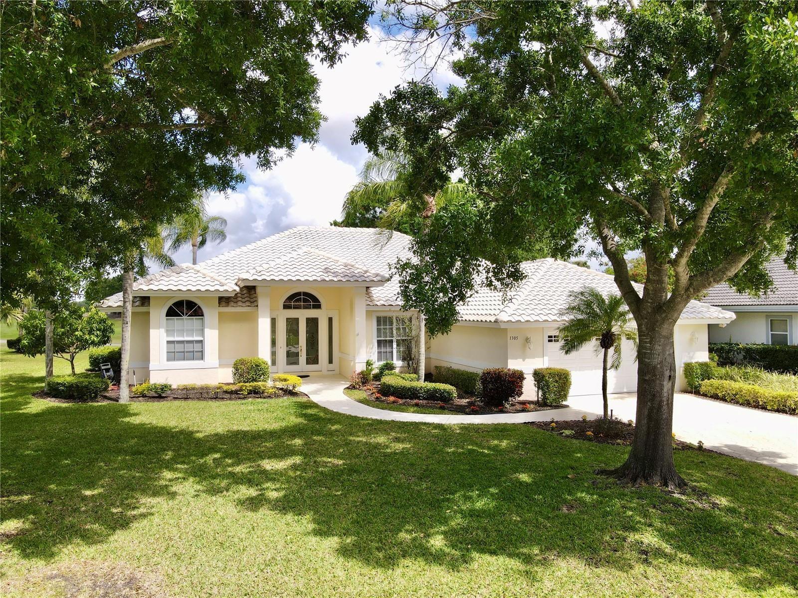 Amazing Home With Tranquil Views - ASSUMABLE must qualify Loan 2.99% 228K Balance! Enjoy Your Morning Coffee Partaking In Natures Glory - Overlooking The 4th Green! Golf Front - Pool Home...This Amazing Light And Bright Home Features Soaring 12' Ceilings, Natural Light Throughout, Updated Kitchen With Smooth Granite, Stainless Steel Appliances, Solar Tube, Tile Floors, New Laminate for Bedrooms, Cabinetry In Laundry, Split Floor Plan, Tons Of Storage And Closets, Pool Was Recently Resurfaced, Huge Lanai All Covered And Screened, Lush Landscaping And So Much More!