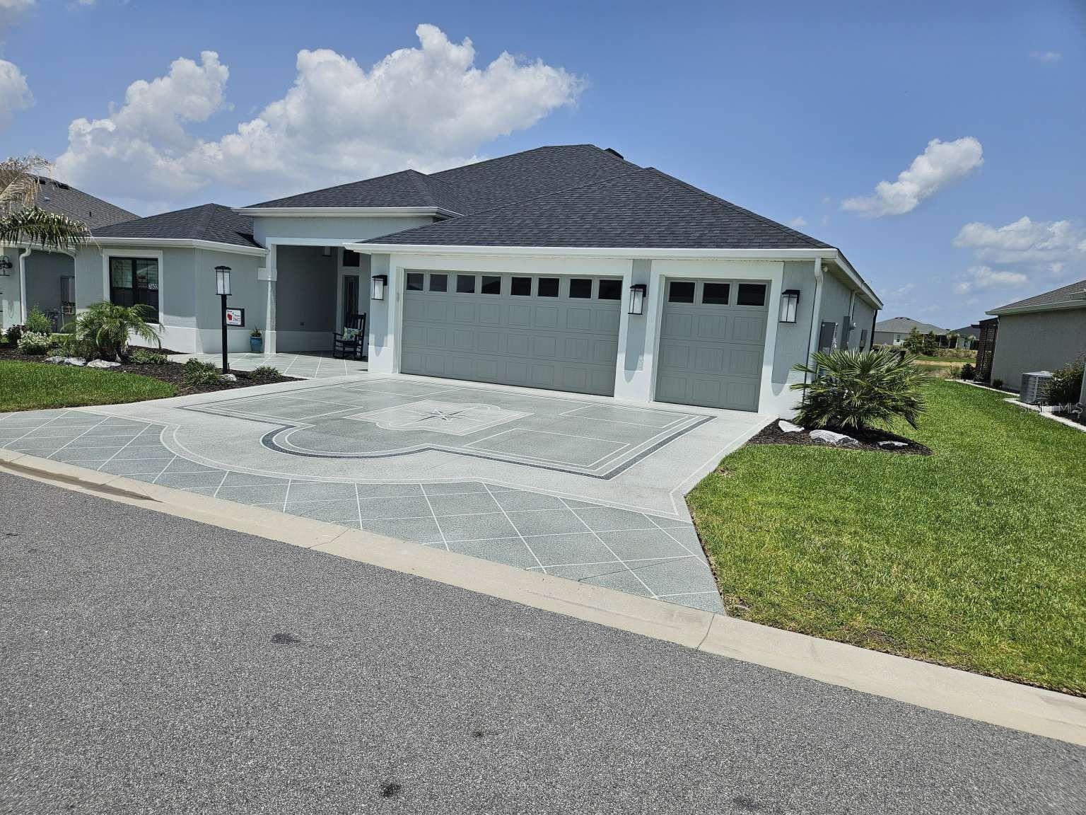 Welcome to luxury living with this gorgeous, 4/3 designer home nestled on a beautiful water view site in the popular Village of Shady Brook. This home boasts unparalleled views of the lush Florida landscape with plenty of serene nature to behold! From here, it's a very short distance to Eastport Town Square where you can shop, dine and dance while listening to the nightly live music to your heart's content.

Enjoy the spacious, open layout that includes luxury vinyl plank floors throughout. Upon entering, your eye is drawn to the beautiful pond off the back yard and the sparkling 13' x 30' swimming pool completed for you by T&D Pool Company that is customized to perfection with: an expansive bird cage enclosure, a built-in solar blanket, an impressive waterfall, beautiful mosaics and a sun shelf. The home features neutral colors, crown molding, a stunning feature wall, plantation shutters, a Nova water treatment system and gorgeous landscaping. All enhancements have been completed by the best contractors in the area. All you need to do is move in and start living the dream!