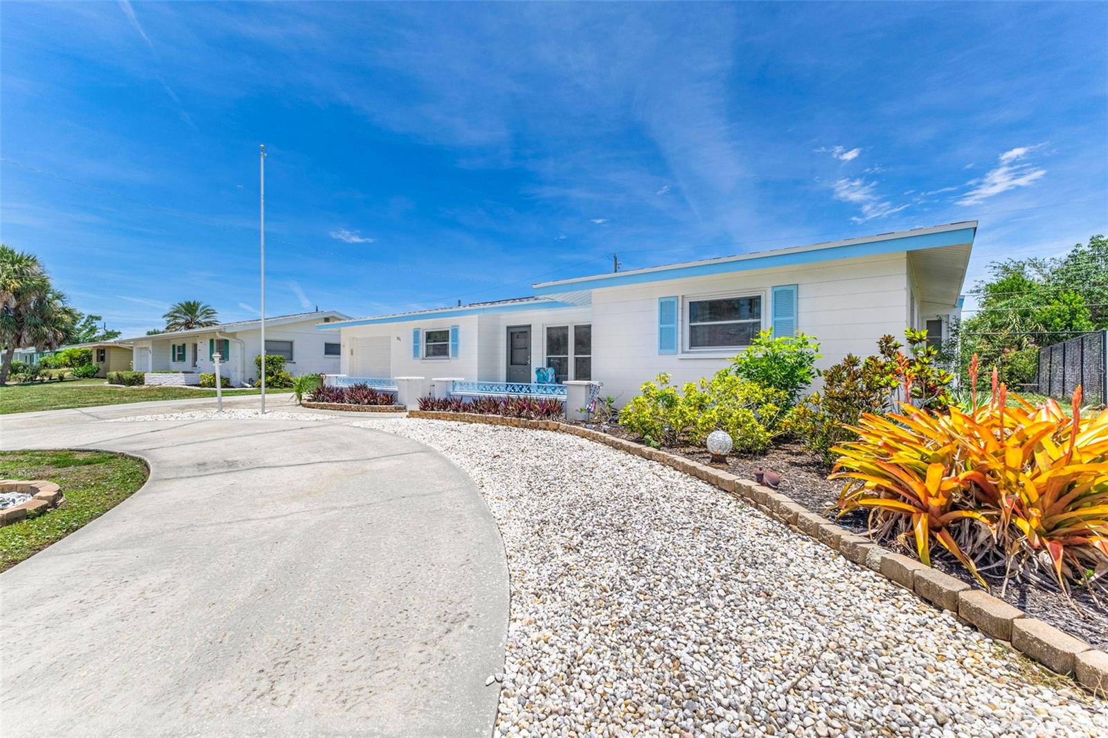 Discover “Old Florida” Charm in this spacious 2 bedroom 2 bathroom home located in the beautiful community of Venice Gardens in Venice, Florida.  Out front you'll find a spacious circular driveway offering plenty of parking for your vehicles and toys and a sunny front porch leading  to your front entry which features a new hurricane impact door (2022) for added security.  Alternatively you can chose to enter your home through the single car attached garage featuring an updated garage door (2023).  Once inside you’ll find a bright and open living area that leads you to a light filled Florida room, dining room and recently updated kitchen including wood cabinetry and granite counter tops.  The primary bedroom has a walk in closet and its’ own bathroom with the second bedroom and bathroom just down the hall.  Your indoor laundry comes equipped with a washer and dryer and features additional storage for your things.  Enjoy sunsets from your covered and screened extra large lanai or from your backyard that has a newer six foot tall, black chain-linked fence with sidewalk and side entry gate for added security and safety.  This home features a new roof (2025) with impact windows and doors throughout providing peace of mind during storm season and also has city water and sewer and is NOT LOCATED IN A FLOOD ZONE.  You’ll be living in the center of everything Venice has to offer including the sparkling waters of the Gulf and our beautiful Venice beaches, Venice Fishing Pier, Lake Venice Public Golf Course, the Legacy Bike Trail, the quaint shops, coffee houses, restaurants and entertainment in our historic downtown, the post office, grocery stores, department stores, home improvement stores and more.  Venice Gardens has an OPTIONAL HOA that provides membership to the Venice Gardens Civic Association and access to the swimming pool.  The association offers different community events throughout the year.  Schedule a private showing to get your piece of the Florida lifestyle and start soaking up the sunshine today! Furnishings optional.