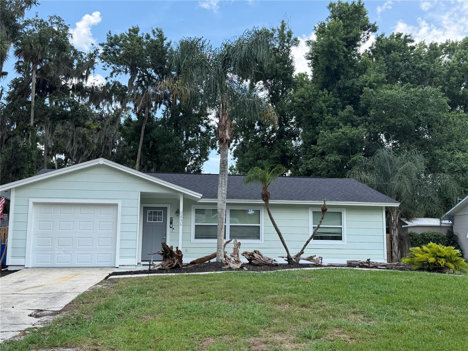 Completely renovated in 2024..This beautiful home has a New Kitchen with high end quartz and an LG Appliance Package..The flooring is LifeProof 22ML Luxury Vinyl throughout the home..Both bathrooms have been redone and the master has a rain shower head!! All new paint and trim painted gray as designer touch../new roof, new outside deck, and NO HOA! This is a 3 bedroom, 2 bath with one car garage, close to shopping, entertainment and the Beach! You will love the Open concept kitchen and living with luxury wood cabinets anf huge Island in kitchen...The back yard is fenced and has a shed and patio that can be screened for outdoor parties!