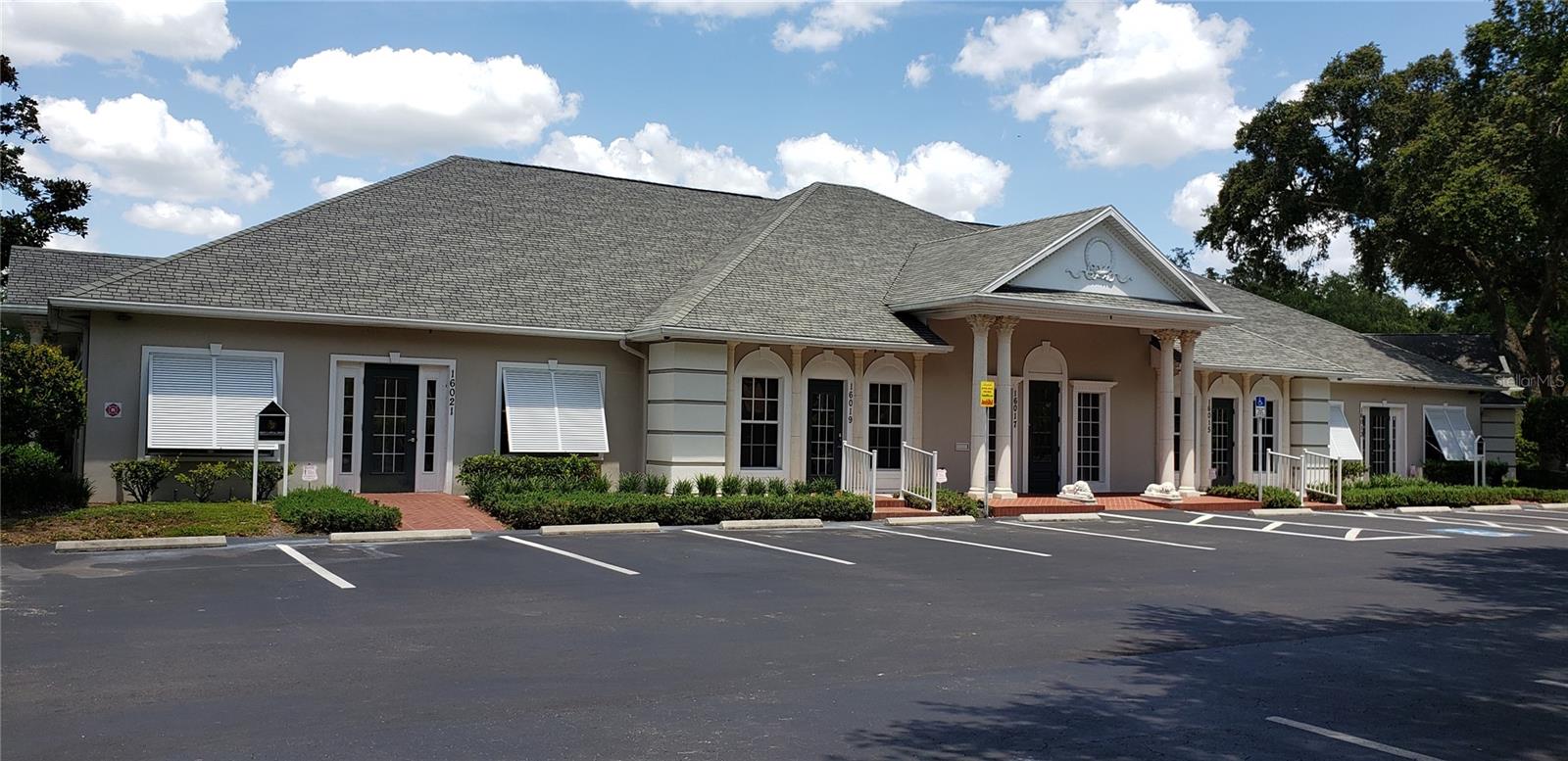 GREAT OPPORTUNITY FOR OWNER-OCCUPIED OR INVESTOR TO ACQUIRE MULTI-UNIT FREE STANDING EXECUTIVE, WATERFRONT OFFICE BUILDING.  Contains five waterfront office suites, each under 2,000 s.f. with separate utilities, street addresses and drive-up private entries. One can be available upon closing for new owner occupancy and the other four are leased, providing immediate income.   Staggered personal guaranteed leases with exceptional returns and annual escalators.

The Magnolia Center is a unique 4 building (all lakefront) park-like executive office center.  The buildings feature timeless Southern architecture including premium designer shingles, hand-cast concrete Corinthian columns, herringbone brick walkways and abundant parking.

Location. Location. Location. This desirable location has 400 feet frontage on busy US-41, North Florida Avenue in North Tampa. Conveniently located within minutes to I-275, Carrollwood, University of South Florida, Moffit Cancer Center, New Tampa, and the explosive growth of Pasco County (Lutz, Land O'Lakes, Wesley Chapel). This incredible location is all within walking distance to Avila, Publix and a new Starbucks!  
NO SIGN, PLEASE DO NOT CONTACT TENANTS.