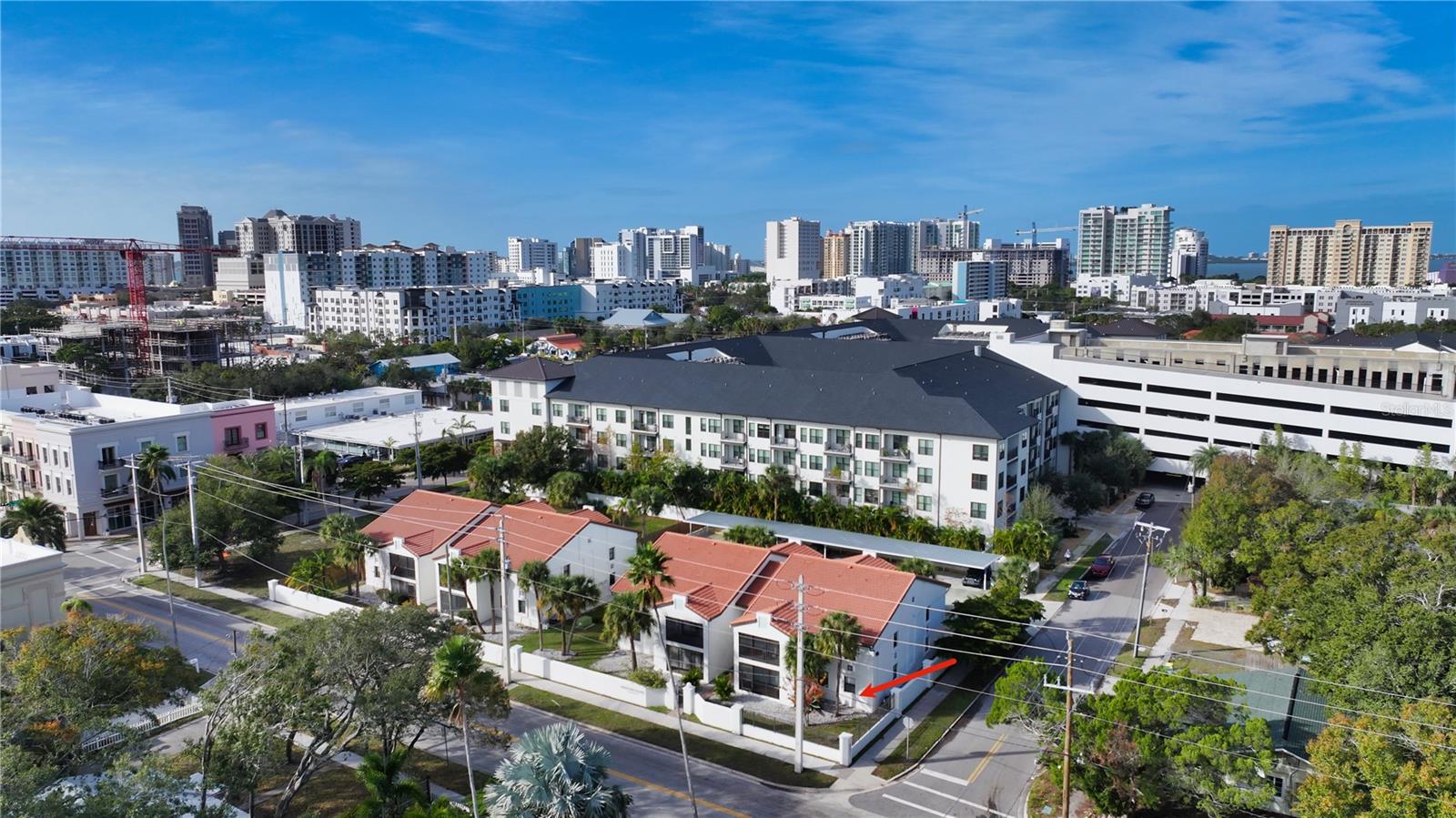 Downtown Sarasota living becomes exceptionally attainable with this beautifully renovated first-floor residence in the heart of the Rosemary District. One of only a handful of two-bedroom, two-bath residences currently available under $400,000 in the downtown Sarasota market, this move-in-ready home offers an unmatched combination of walkability, modern updates, low ownership costs, and immediate access to Sarasota’s vibrant urban lifestyle.
Located within the charming Mentone Court community of just 16 residences, this beautifully updated unit sits above the flood plain and includes assigned covered parking only steps from the front door. Positioned within a “Walker’s Paradise” location, the residence is just a five-minute stroll to Main Street’s dining, boutiques, and cafés, a few blocks from Whole Foods, and moments from the Rosemary District’s growing collection of restaurants and outdoor gathering spaces. Citrus Square—located less than a block away—offers additional dining options and convenient access to the Bay Runner trolley and public scooter transportation for effortless connectivity throughout downtown Sarasota and the beaches.
Inside, the residence has been extensively renovated and thoughtfully designed with a clean, contemporary aesthetic. High ceilings, porcelain tile flooring, 5-inch baseboards, plantation shutters, and four closets create a bright and spacious atmosphere throughout the more than 1,000-square-foot layout. The open-concept kitchen features quartz countertops, handcrafted Moroccan Zellige tile backsplash and island accents, solid hickory dovetailed cabinetry, and new Samsung smart Wi-Fi appliances including an induction range and quiet dishwasher.
Both bathrooms have been beautifully reimagined with designer tile, Kohler Awaken fixtures, Choreograph shower systems, and premium glass enclosures, while a new LG heat pump washer and dryer adds everyday convenience. The residence is being offered furnished, including most furnishings, artwork, and a 75-inch Frame television, creating an ideal turnkey downtown residence, investment property, or seasonal pied-à-terre.
One of the home’s standout features is the oversized private lanai with storage closet, opening directly to a tranquil green space and private gated access toward Citrus Square. A motorized Kevlar storm and sunshade system rated for Category 5 hurricane protection enhances both security and year-round usability.
Mentone Court offers exceptional value with low HOA fees that include master insurance on the structure, water, sewer, trash, landscaping, exterior maintenance, and reserve funding. The professionally managed association is fully funded with no planned special assessments. The community is exempt from milestone inspection requirements due to its low-rise construction and has never experienced storm damage.
Perfectly positioned near Payne Park and the Legacy Trail, the residence also offers convenient access to St. Armands Circle, Lido Beach, Longboat Key, Sarasota-Bradenton International Airport, and downtown Sarasota’s renowned cultural attractions including theaters, galleries, waterfront parks, and fine dining. Stylish, low-maintenance, and exceptionally walkable, this downtown Sarasota residence delivers an outstanding opportunity to enjoy elegant city living with easy beach access.