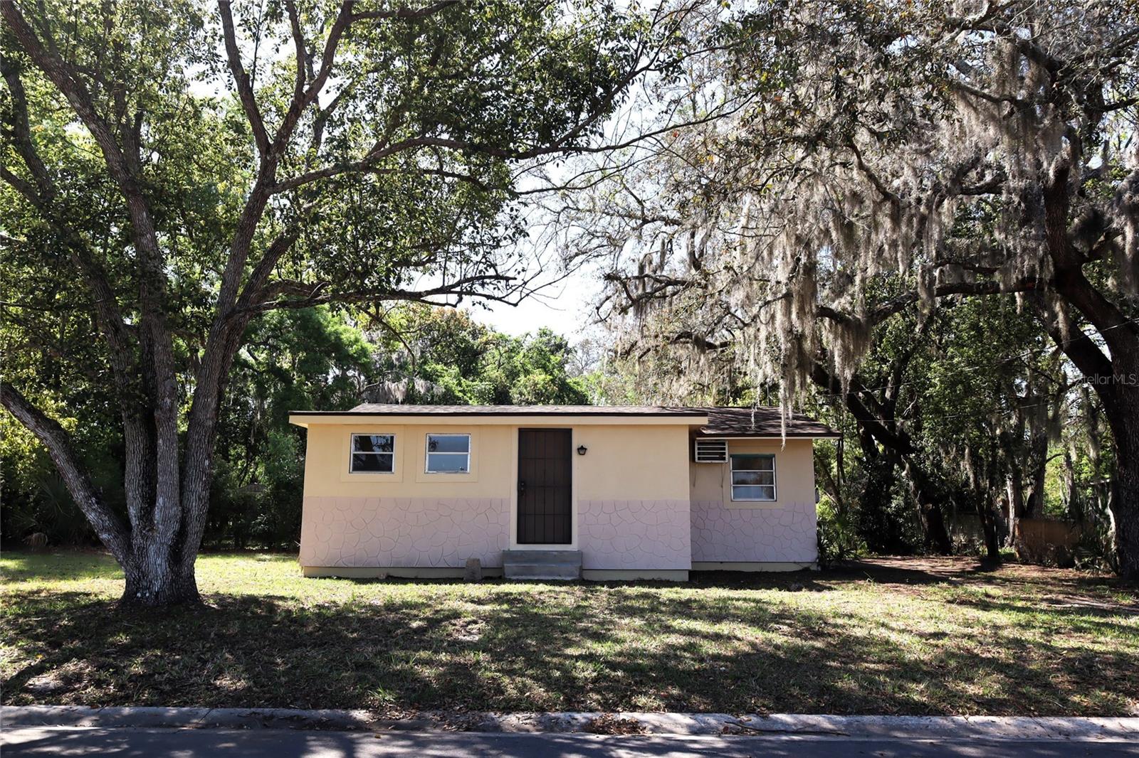 Welcome to this beautifully maintained 1-bedroom, 1-bathroom home tucked away on a quiet dead-end street in Eustis, offering privacy, comfort, and endless possibilities. Situated on an oversized 0.30-acre lot, this property provides ample space for trucks, recreational vehicles, boats, pets, or future expansion, and may even available subdivision potential for additional investment opportunities. As you enter the home, you'll find a functional kitchen that flows seamlessly into the formal dining area, creating an inviting space for everyday living and entertaining. A versatile office/den is conveniently located near the front of the home, ideal for working remotely, hobbies, or additional guest space. The spacious living room offers plenty of room for a large sectional or modern furniture arrangement, while the oversized primary bedroom provides exceptional comfort and additional space for bedroom furnishings. Inside, the home features luxury vinyl flooring throughout, combining style, durability, and easy maintenance for a clean, modern look. Additional storage is available with both an interior storage room and an outdoor storage shed. Step outside to enjoy the expansive backyard, perfect for entertaining family and friends, creating a garden oasis, or simply relaxing in your own private outdoor retreat. Recent updates include a new water heater, new dishwasher, and new wall A/C unit (2026), giving buyers added peace of mind and value. Whether you're searching for a primary residence, a weekend getaway, or an investment property with room to grow, this Eustis gem offers a unique combination of space, privacy, and future potential that is hard to find.