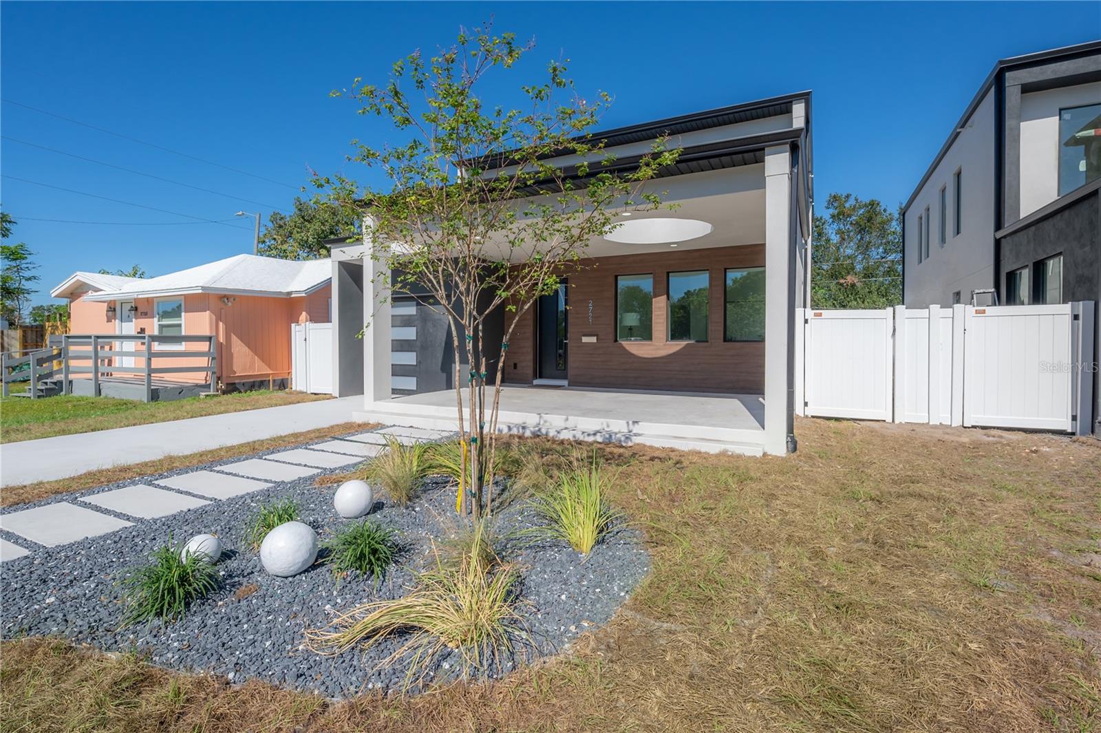 Experience the perfect blend of comfort, style, and sophistication in this stunning new construction two-story home in the desirable North Kenwood neighborhood near downtown St. Petersburg. Featuring 4 bedrooms and 3 bathrooms, this residence showcases modern design and thoughtful details throughout. The open-concept living area welcomes you with luxury vinyl plank flooring and large PGT hurricane-impact windows that fill the home with natural light. The chef’s kitchen is a true showpiece, complete with custom solid wood cabinetry, exquisite countertops, and premium stainless-steel appliances. Upstairs, you’ll find 3 of the bedrooms, offering a peaceful separation from the main living spaces. The primary suite is a private retreat with a spacious balcony, ideal for sipping morning coffee or unwinding at sunset, and a luxurious en-suite bathroom adorned with modern finishes. Additional highlights include an EV charger for electric vehicles and a beautifully designed front porch that harmonizes contemporary architecture with natural elements for exceptional curb appeal. This home offers the best of modern living in one of St. Pete’s most desirable areas—schedule your private showing today!  HOME COMES UNFURNISHED.
