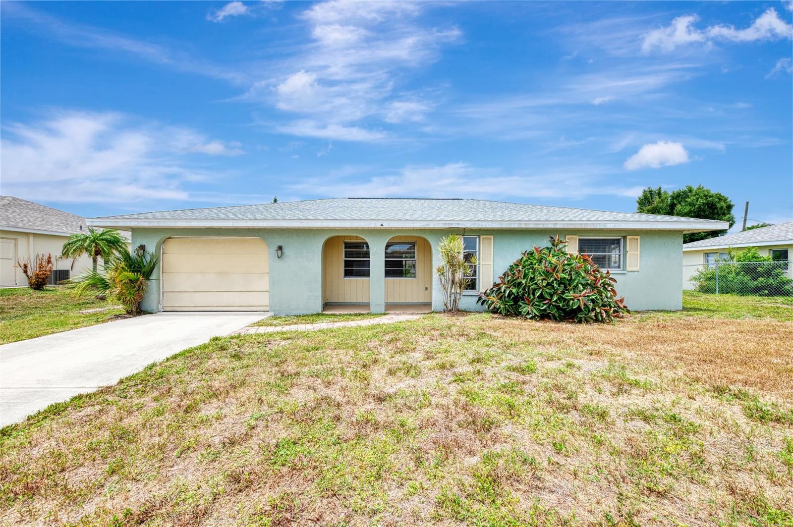 Virtually Staged. Appealing two bedroom, two bath, one car garage, South Venice home. Put your own touch on this home, to your own liking. Combination living room and dining area, with sliders out to your large lanai. There is also an outdoor porch. The roof was replaced in 2023 and the water heater in 2024. The AC system was replaced in 2016. Belong to the South Venice Beach Association, if you choose, for use of their boat ramp and the ferry. Come and see this great buy today!