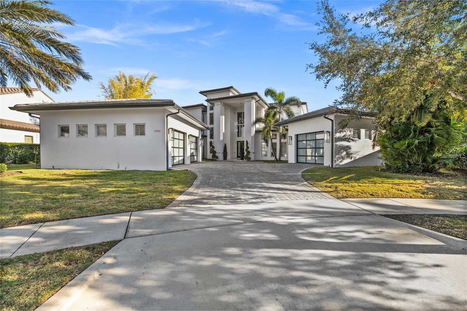 Lakefront, Luxurious, home with Private Pool in Windermere. A True Paradise! Discover this rare gem in the heart of Windermere,
located in the gated community of Casa Del Lago — a spectacular residence that combines sophistication, comfort, and stunning lake views. with over eight expertly designed rooms, this home was carefully customized by the builder down to the smallest detail — from the
finishes to the overall design. With four suites, four full bathrooms, and three powder rooms, this home was designed to delight at every turn.
Upon entering, you're welcomed by a grand entry hall with soaring ceilings over 10 feet high and elegant porcelain tile flooring, enhancing the
space’s refined atmosphere. The living room, complete with a fireplace, offers a cozy yet sophisticated ambiance, while the kitchen is a
showstopper: spacious, quartz countertops, a large island with a waterfall design,
and impeccably finished custom cabinetry. The master suite, located on the second floor, is a true retreat. It features a private sitting area, a
fireplace, and a spa-like bathroom with a double shower, dual sinks, and a sophisticated design focused on your comfort. In addition to the
master suite, the second floor includes additional bedrooms and a versatile living area, ideal for use as a home theater or game room. On the
ground floor, a guest suite provides the perfect space for entertaining visitors. The home also offers expansive balconies on both floors with
panoramic lake views, seamlessly connecting indoor living areas to a breathtaking outdoor setting. Outdoor features include a terrace, a deck, a
pool with a resort-style spa, and a gourmet area — perfect for entertaining friends and family. The entire home is hurricane-proof, offering
maximum safety and peace of mind for your family. Located in one of Florida's most desirable areas, you'll be near fine dining, luxury shopping,
premier entertainment, and, of course, just minutes from the Disney Parks. Don’t miss this unique opportunity to live in style at one of
Windermere’s most prestigious addresses. Schedule your visit today and experience this true gem in person!