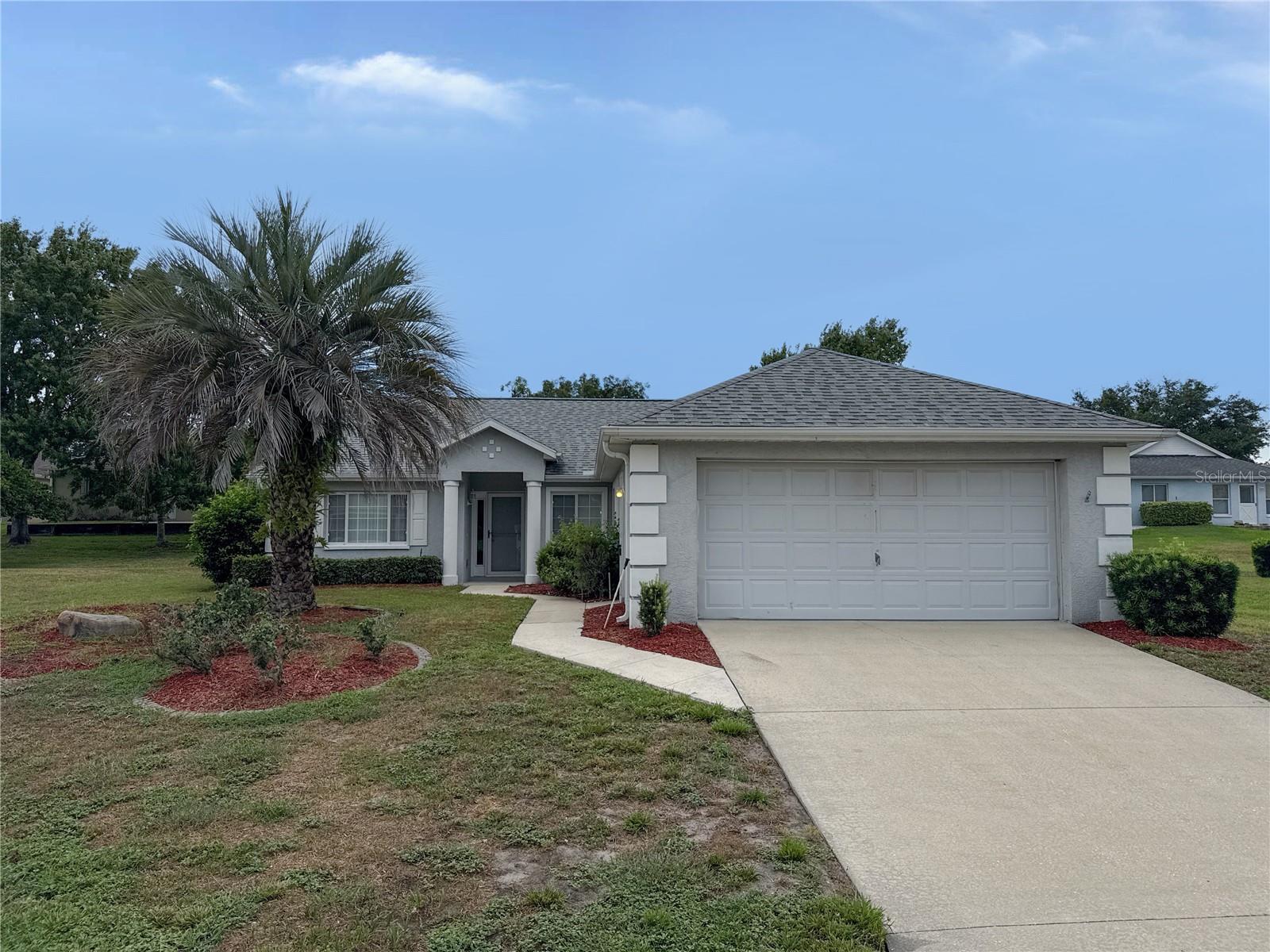 Welcome to this well-maintained 2-bedroom, 2-bath home in the desirable gated 55+ community of Ocala Palms. Featuring updated luxury vinyl plank flooring, new carpet in select areas, and tile throughout the main living spaces, this home offers a comfortable and inviting interior. The kitchen is equipped with stainless steel appliances, including a range, vent hood, and dishwasher, while the attached two-car garage provides added storage and convenience. Residents of Ocala Palms enjoy access to a golf course, clubhouse, swimming pools, fitness center, tennis courts, and a variety of community activities. Ideally located just off US Highway 27 with convenient access to I-75, this home is only minutes from shopping, dining, medical facilities, and the World Equestrian Center, with downtown Ocala just a short drive away. Don't miss this opportunity to enjoy low-maintenance living in one of Ocala's most popular active adult communities. Call for your showing today!