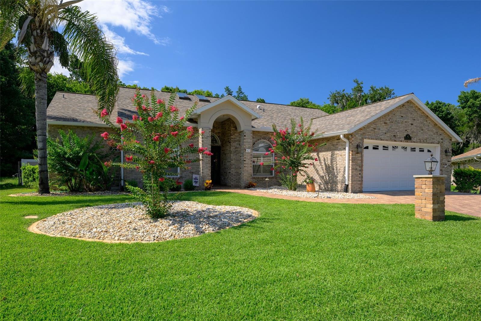 Some homes simply check the boxes. Others create a lifestyle.

Welcome to 42 Bryan Cave Road, a beautifully maintained home tucked into one of South Daytona's most established neighborhoods. Surrounded by mature landscaping and offering exceptional privacy, this property provides the perfect balance of comfort, convenience, and outdoor living.

Designed for both relaxing and entertaining, the backyard is truly the heart of the home. Enjoy a resurfaced saltwater pool, propane-heated spa, outdoor shower, steam room, and spacious patio areas that create your own private retreat. Beautiful landscaping surrounds the property, while permanent Trim Lighting adds year-round charm and has made this home a neighborhood favorite during the holidays.

Inside, the flexible split-bedroom floor plan offers comfortable living with a wood-burning fireplace, plantation shutters, formal and casual dining spaces, a walk-in pantry with wall safe, and a dedicated office or den. The primary suite features direct access to the pool area, creating a seamless connection between indoor and outdoor living.

Additional features include a paver driveway, hurricane-rated garage door, deep-well irrigation system, SafeTouch security system, transferable termite bond, detached storage building, and a poolside storage room for added convenience.

Located just minutes from parks, schools, shopping, dining, the Intracoastal Waterway, and Daytona's beautiful beaches, this home offers the rare opportunity to enjoy a peaceful, private setting while remaining close to everything.

Lovingly maintained and thoughtfully improved, 42 Bryan Cave Road is a place to relax, entertain, and enjoy the Florida lifestyle for years to come.
