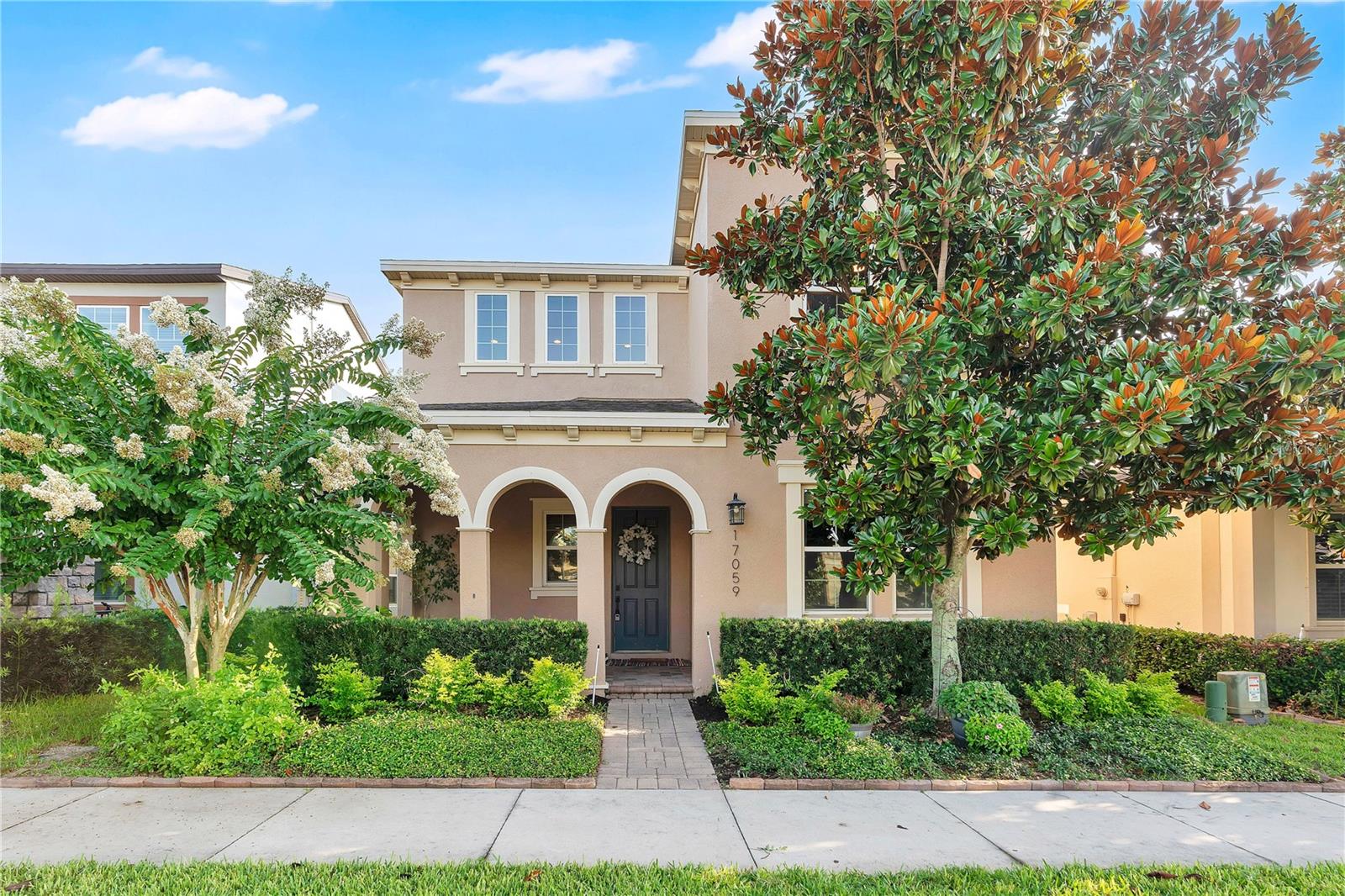 When you think elegance, convenience and affordability, this home has it all!  Situated inside the desirable Waterside community in Winter Garden, you will find this beautifully designed home, blending timeless sophistication with modern comfort, offering an open floor plan, designer finishes, and exceptional indoor-outdoor living.
From the moment you arrive, the charming covered front porch, mature landscaping, and inviting curb appeal set the tone. Inside, you're greeted by wide-plank luxury vinyl flooring, soaring ceilings, crown molding, and sun-filled living spaces designed for both everyday living and effortless entertaining.
The gourmet kitchen is a true showpiece featuring granite countertops, an oversized center island with seating, farmhouse sink, white shaker cabinetry, stainless steel appliances, gas cooktop, double ovens, subway tile backsplash, a custom, handmade hood and designer pendant lighting. Flowing seamlessly into the spacious dining area and family room, this home is ideal for gathering with family and friends.
Large sliding glass doors open to an expansive covered lanai with a stunning wood-finished ceiling, creating the perfect space to dine outdoors or just relax. The fully fenced backyard provides privacy, while maintaining a low-maintenance lifestyle.
As you journey to the second level, you are greeting by a spacious loft, creating a retreat for unwinding and more closet space.  Two large, additional bedrooms and a full bathroom are set off from the primary suite.  Escape to your luxurious primary suite, offering a spacious walk-in closet and a beautifully upgraded spa-inspired bath, complete with a custom dual-sink vanity with quartz countertops, elegant gold fixtures, an oversized walk-in shower, and designer tile extending to the ceiling.
Additional highlights include double-pane windows, custom window treatments, upgraded light fixtures, abundant storage, an oversized laundry room and pantry and thoughtful designer touches throughout.
Residents enjoy outstanding resort-style amenities including a lakeside community pool, clubhouse, fitness center, playground, unfenced dog park and community dock.
Ideally located in the heart of Winter Garden, this exceptional home is just minutes from shopping, dining, entertainment, theme parks, major highways, and top-rated schools.
This isn't just a home; it's a lifestyle.  Book your showing today!